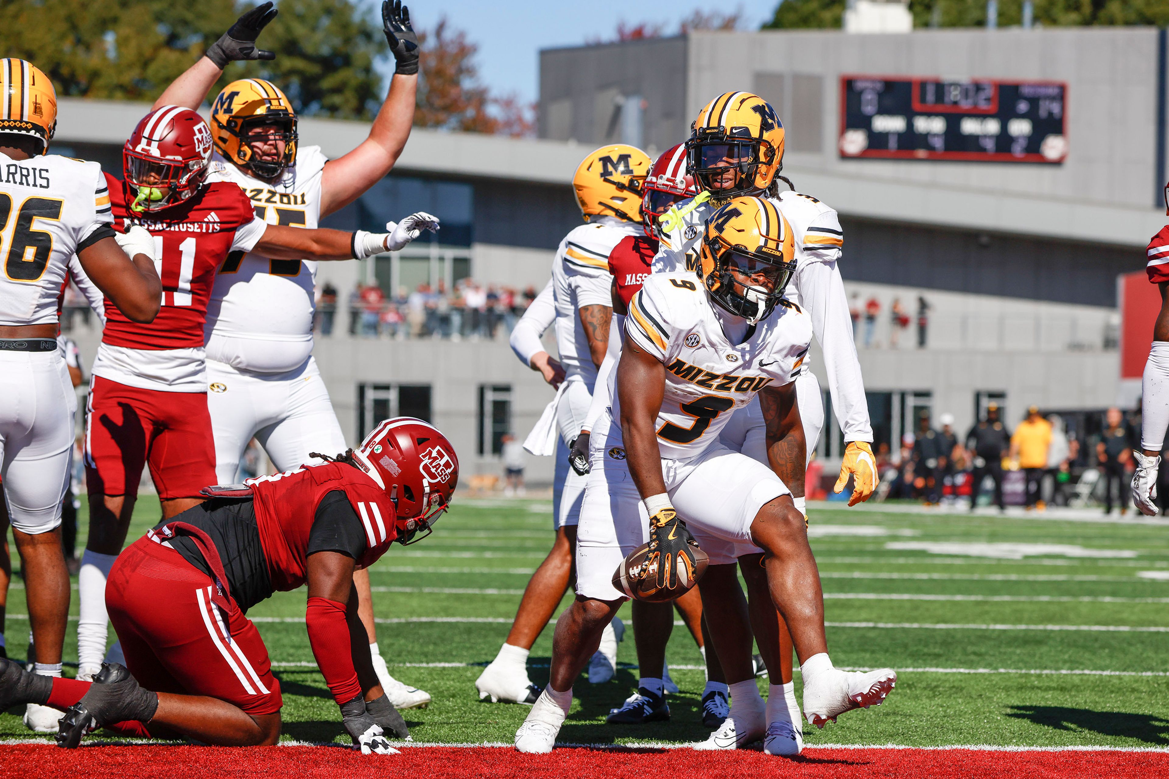 Missouri running back Marcus Carroll (9) celebrates after scoring a touchdown during the first half of an NCAA football game against Massachusetts, Saturday, Oct. 12, 2024, in Amherst, Mass. (AP Photo/Greg M. Cooper)