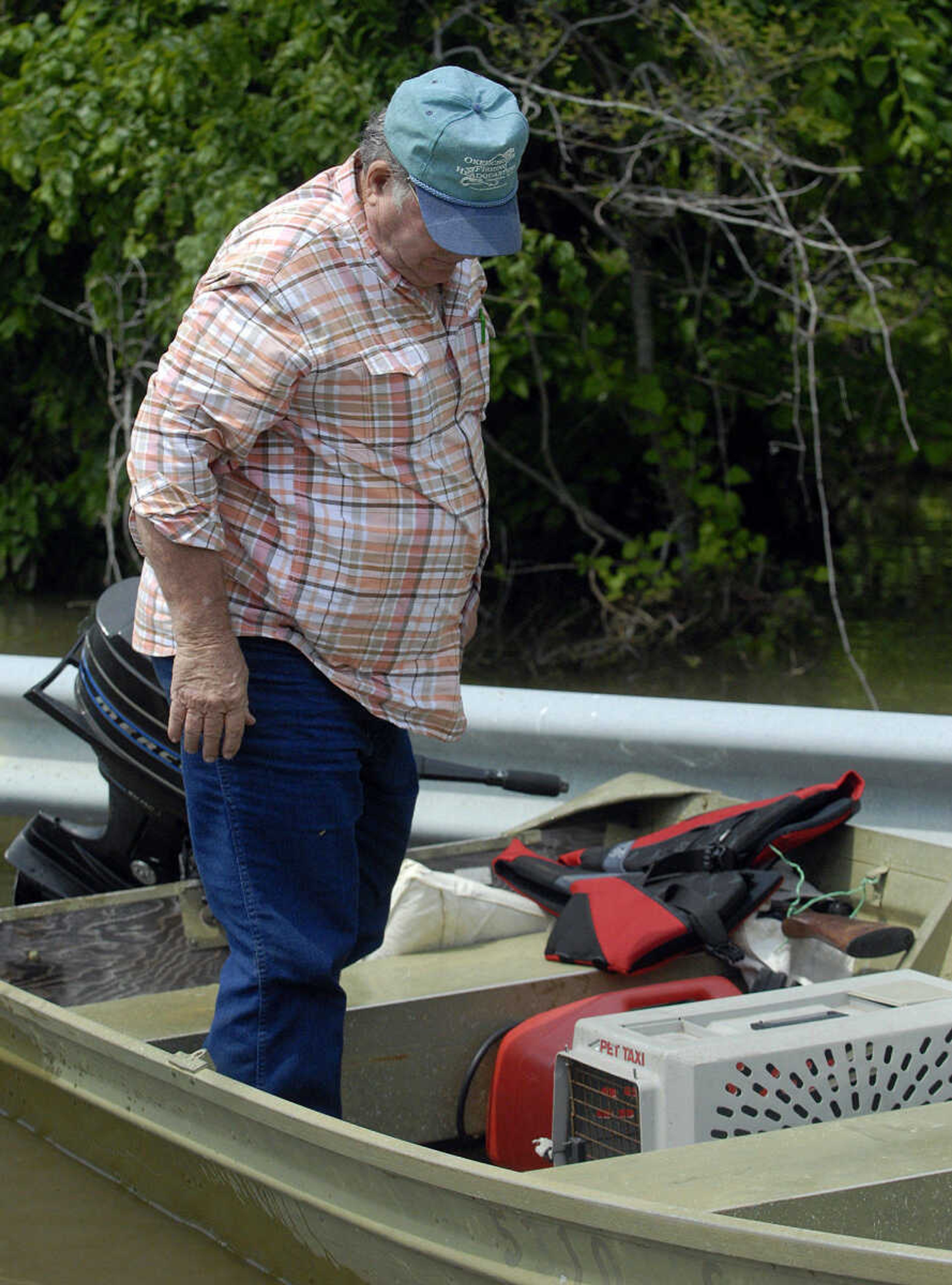 LAURA SIMON~lsimon@semissourian.com
Neal Tinnon arrives back on Highway 102 Monday, May 9, 2011 after checking on his Mississippi County property in the floodway. He took a pet carrier with him in hopes of finding "Shop Cat" and her kittens, but came back empty handed.