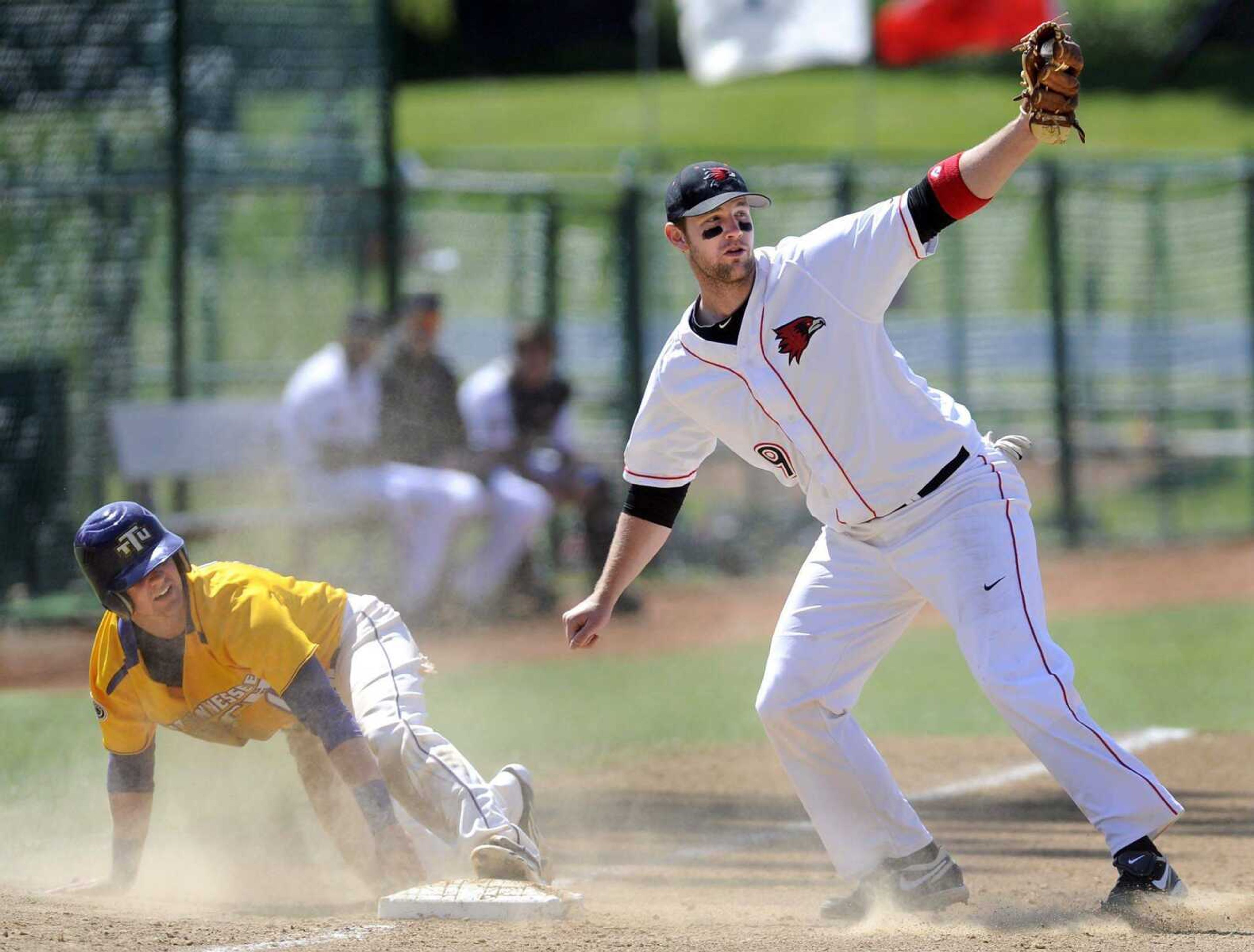 Southeast Missouri State third baseman Trenton Moses looks for the call after tagging Tennessee Tech's Austin Wulf, who was called out on the steal attempt during the second inning Saturday.