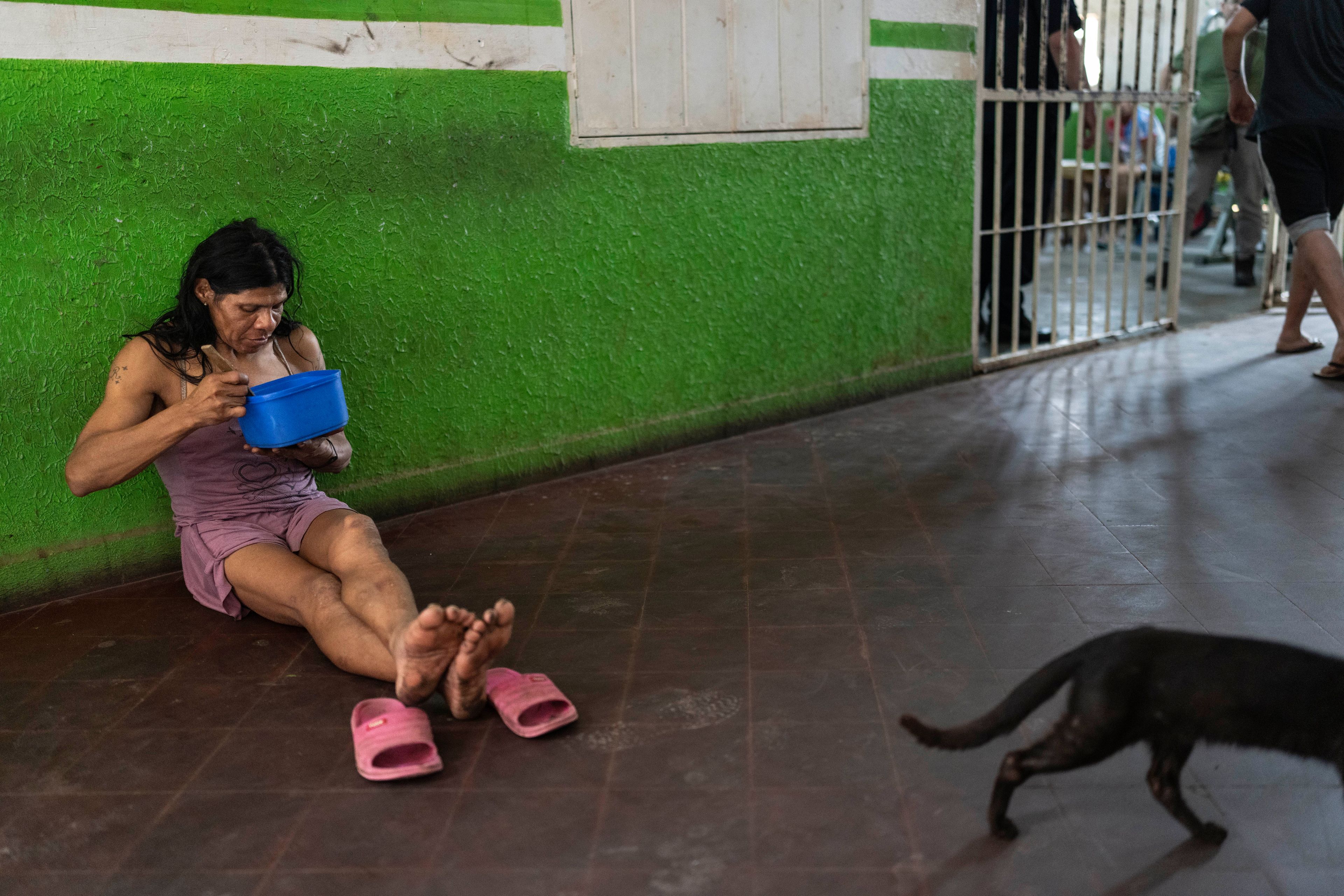 Rocio Gonzalez, sentenced to 16 years for murder, eats lunch inside the pavilion reserved for transgender inmates at the Regional Penitentiary in Coronel Oviedo, Paraguay, Friday, Aug. 30, 2024. (AP Photo/Rodrigo Abd)