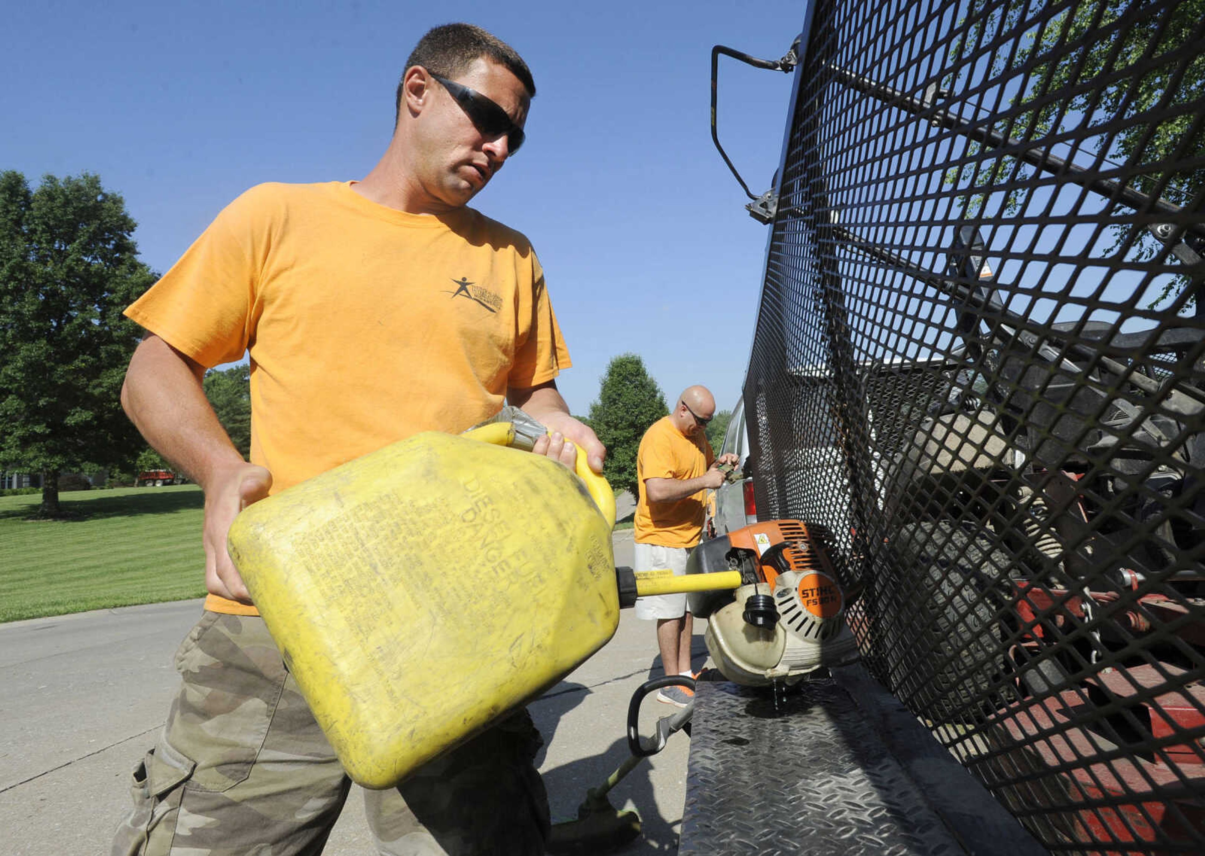 FRED LYNCH ~ flynch@semissourian.com
John Kennedy, a student at Adult and Teen Challenge Mid-America, fills a weed trimmer with gasoline Saturday, June 3, 2017 in Cape Girardeau.