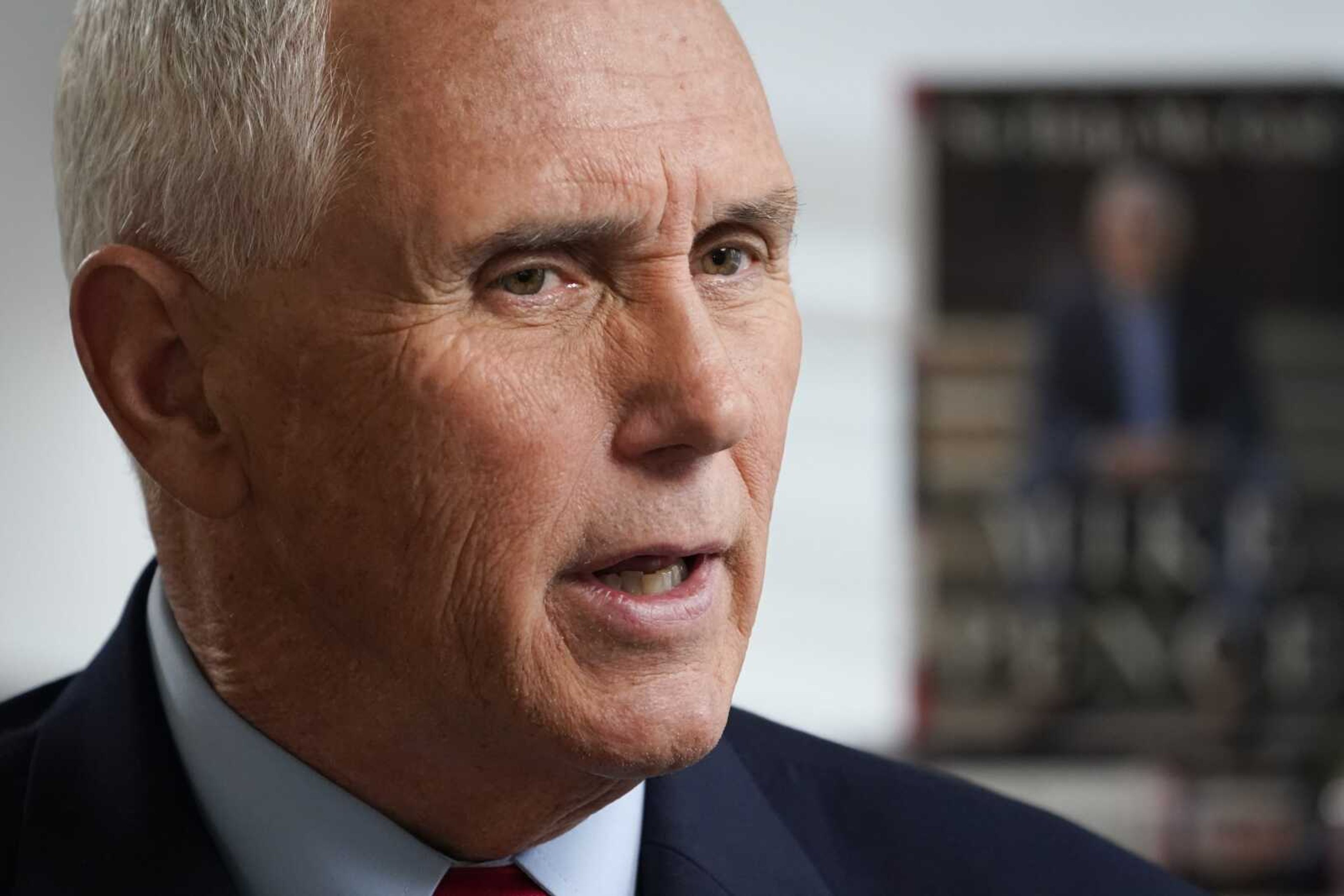 Former Vice President Mike Pence sits for an interview with The Associated Press on Wednesday, Nov. 16, in New York.