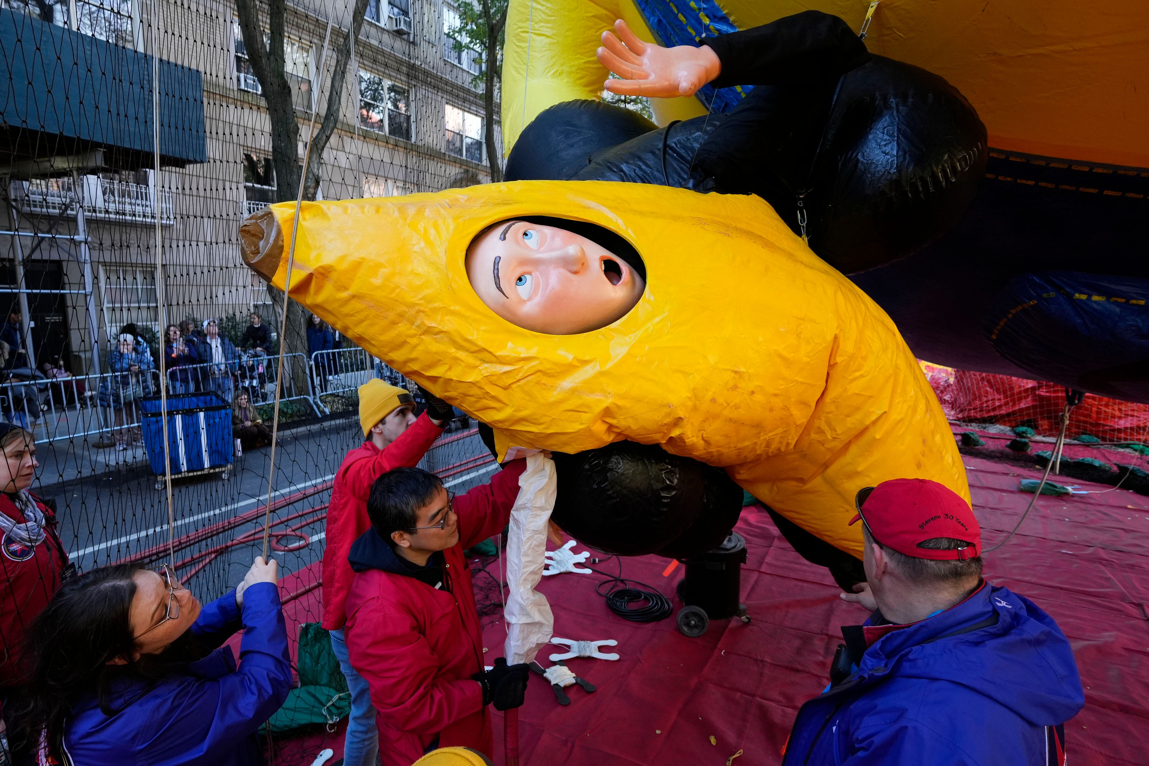 A float featuring a character from the Minions movies is inflated in preparation for the Macy's Thanksgiving Day Parade in New York, Wednesday, Nov. 27, 2024. (AP Photo/Seth Wenig)