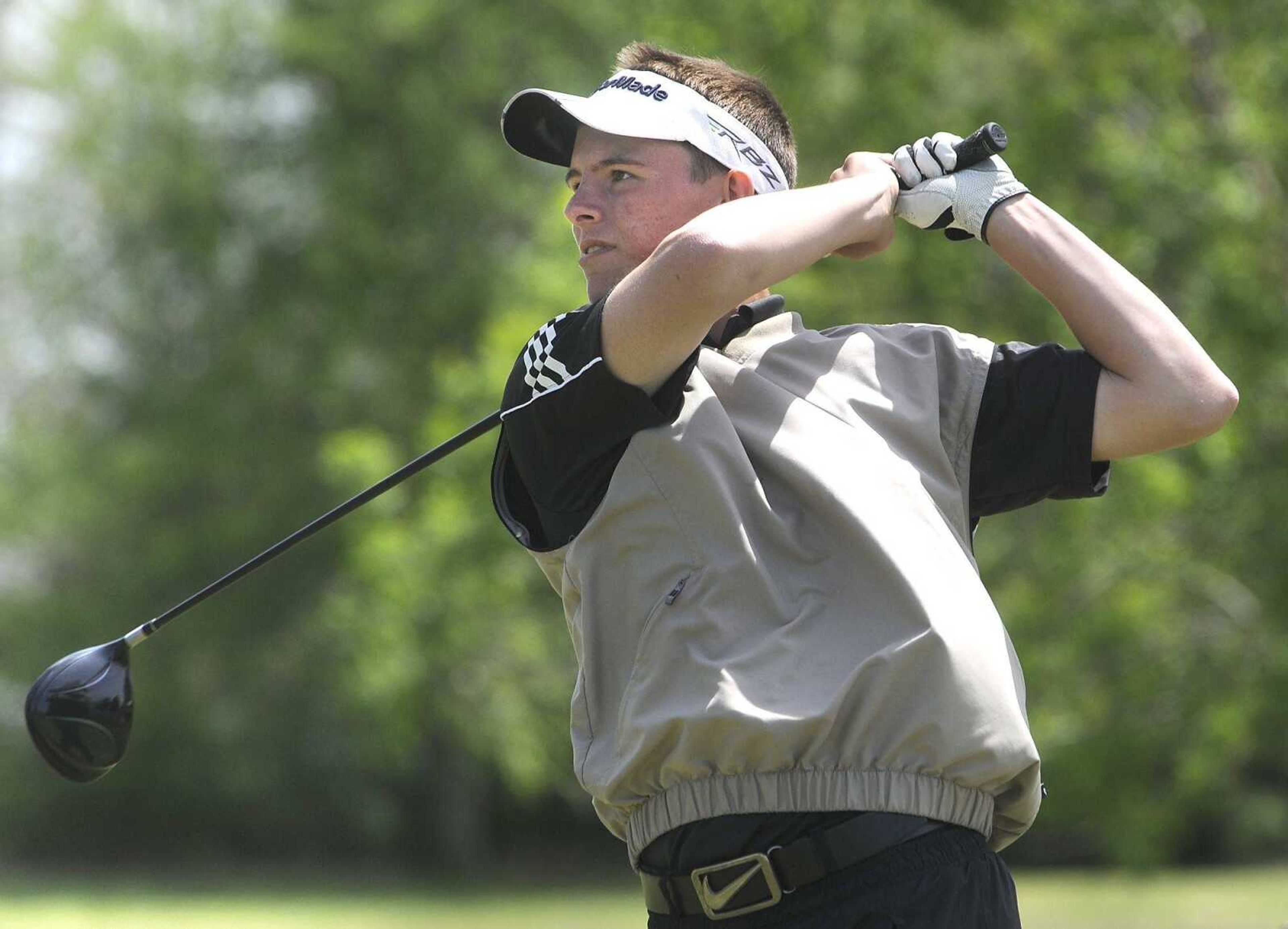 Advance's Brian Whitson watches his drive on the first hole during the SEMO Conference Tournament Monday, April 27, 2015 in Sikeston, Missouri. (Fred Lynch)