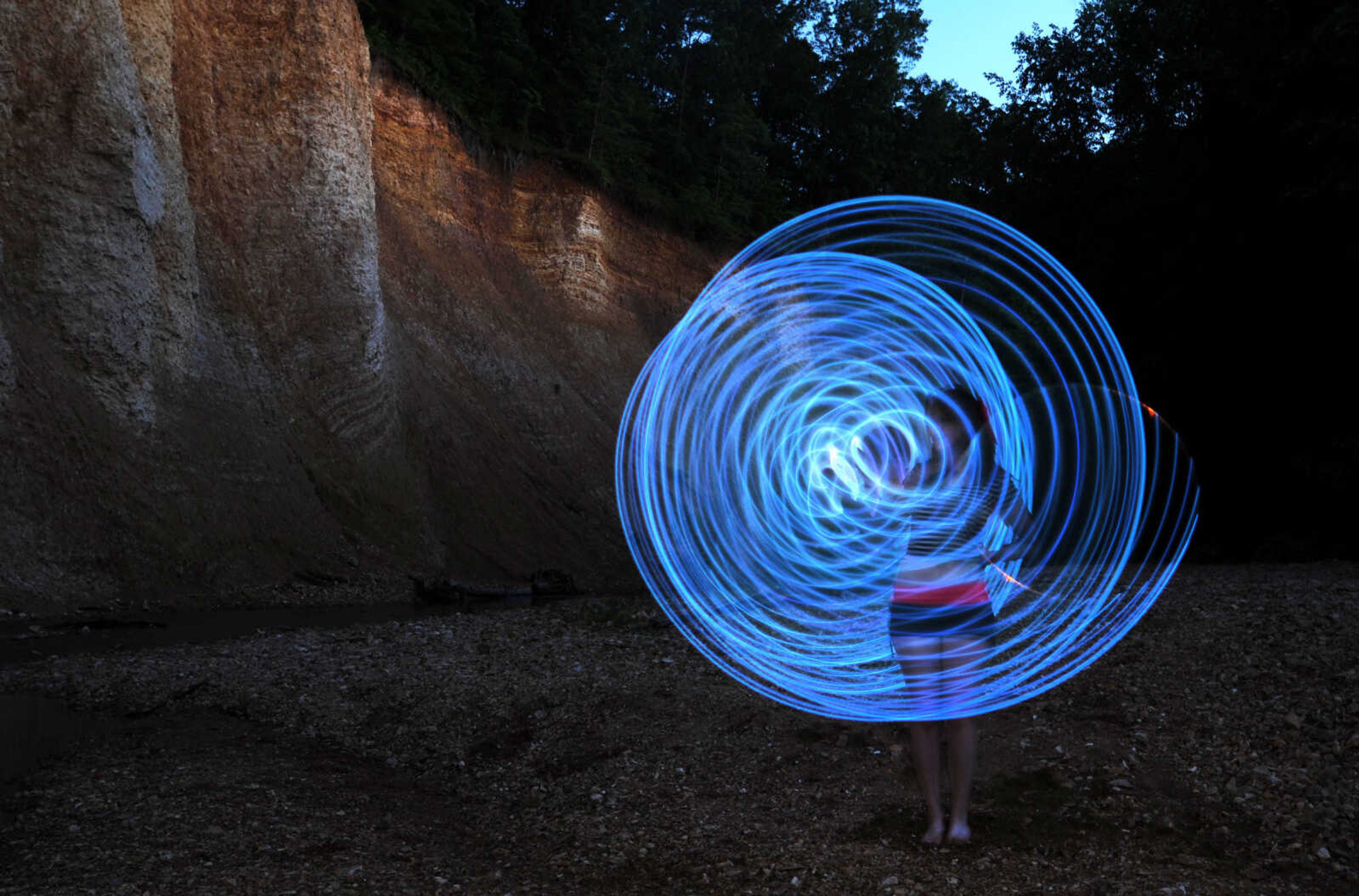 LAURA SIMON ~ lsimon@semissourian.com

Chelsie Welker hoop dances with an LED hoop in a Cape Girardeau County creek, Tuesday, May 26, 2015.