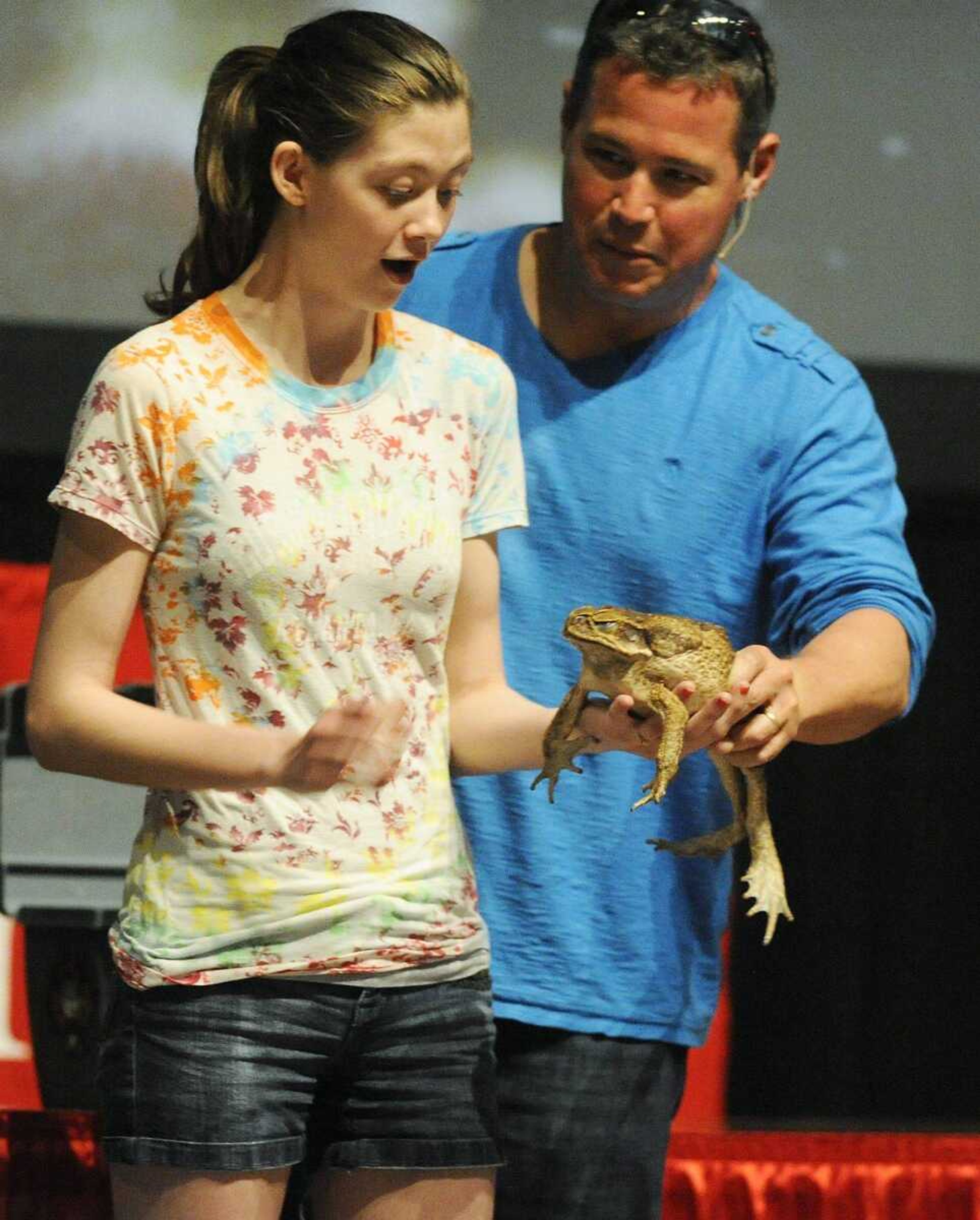 TV host Jeff Corwin hands Southeast Missouri State University student Kaitlyn Dodd a marine toad, the largest species of toad in the world, during his presentation &#8220;Tales from the Field&#8221; on Wednesday at the Show Me Center. (ADAM VOGLER)