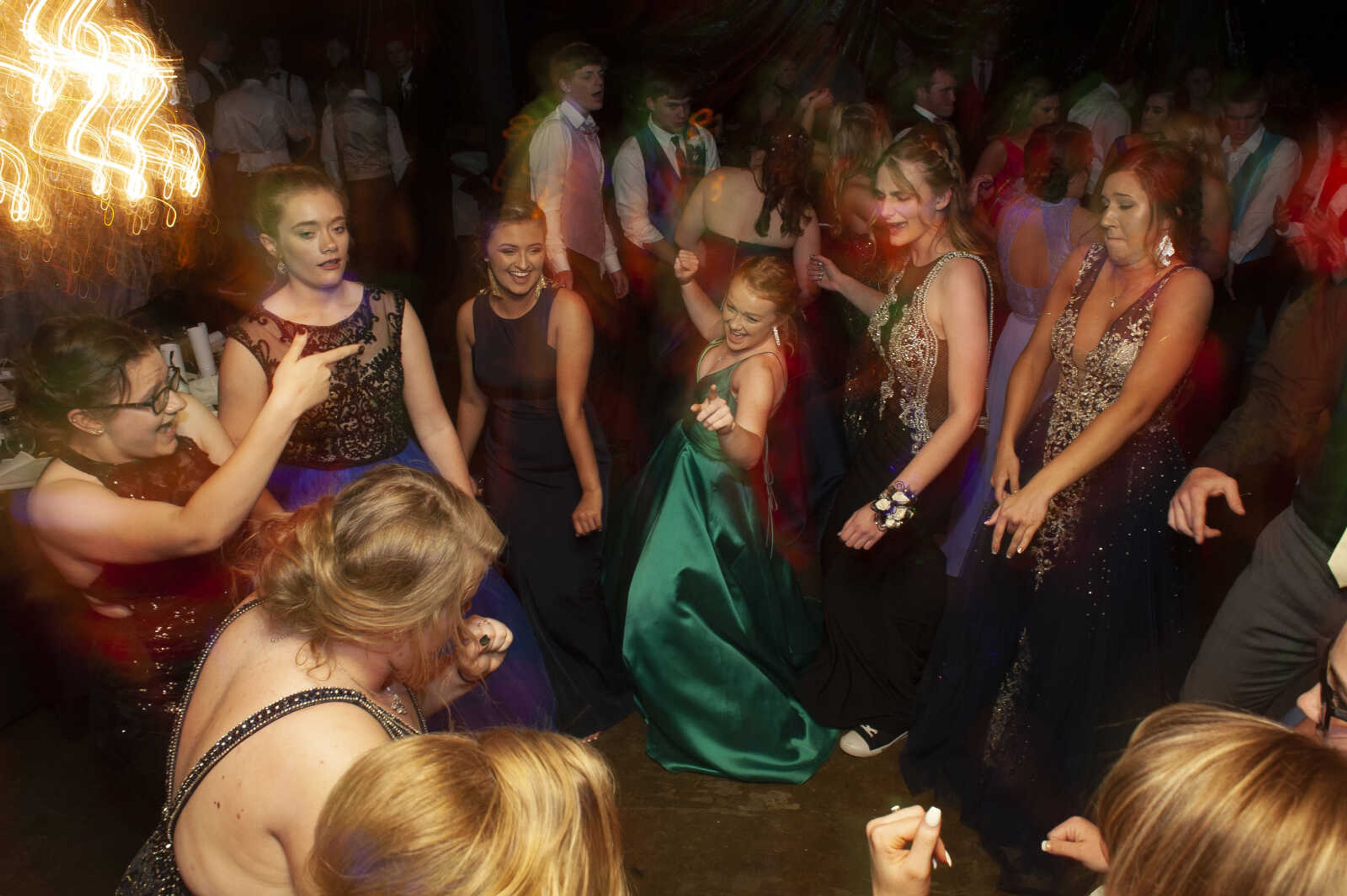 Prom guests dance during Leopold High School's "Masquerade at Midnight" prom Saturday, April 27, 2019, in Leopold.