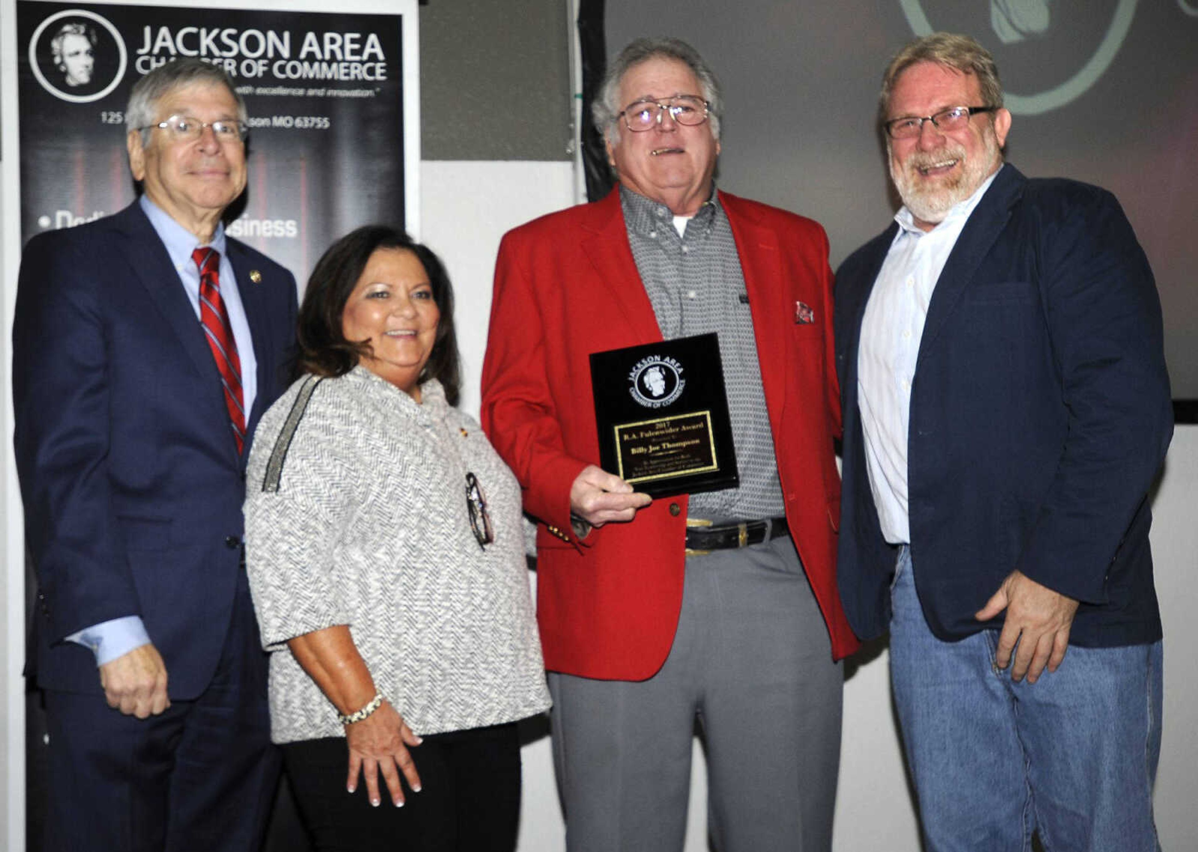 Dave Reiminger, right, presents the R.A. Fulenwider Award to Billy Joe Thompson, with state Sen. Wayne Wallingford, left, and state Rep. Donna Lichtenegger, on Friday at the annual banquet of the Jackson Area Chamber of Commerce in Jackson.