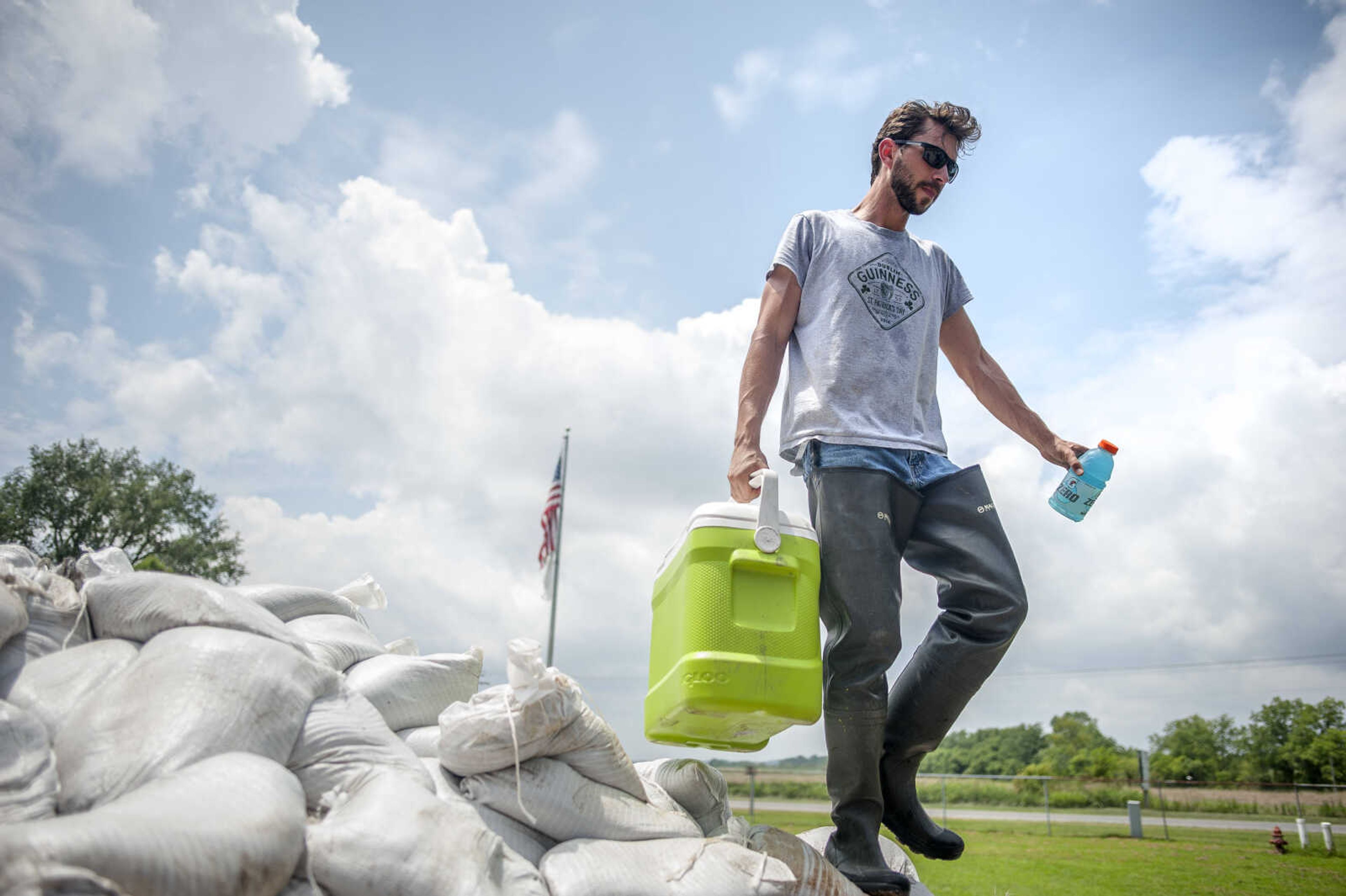 McClure resident Evan Webb is seen on the flatbed of a commercial truck belonging to Mike Taylor Saturday, July 6, 2019, in McClure.