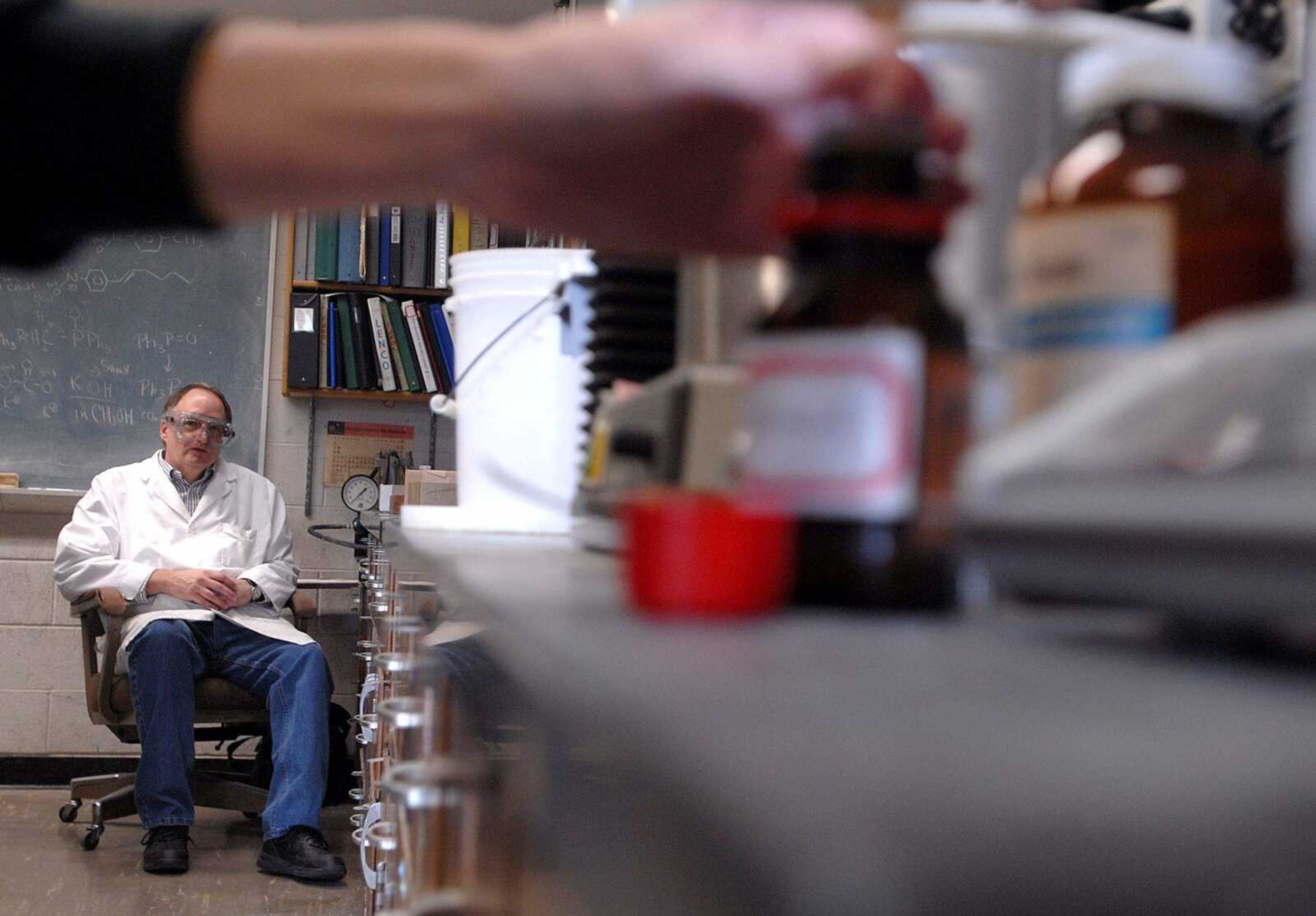 AARON EISENHAUER ~ aeisenhauer@semissourian.com
Dr. Bruce Hathaway oversees as senior chemistry major Jamie Moravec measures out chemicals on a scale Wednesday in Magill Hall on the Southeast Missouri State University campus. Hathaway handles the chemistry side of research into possible new drugs.