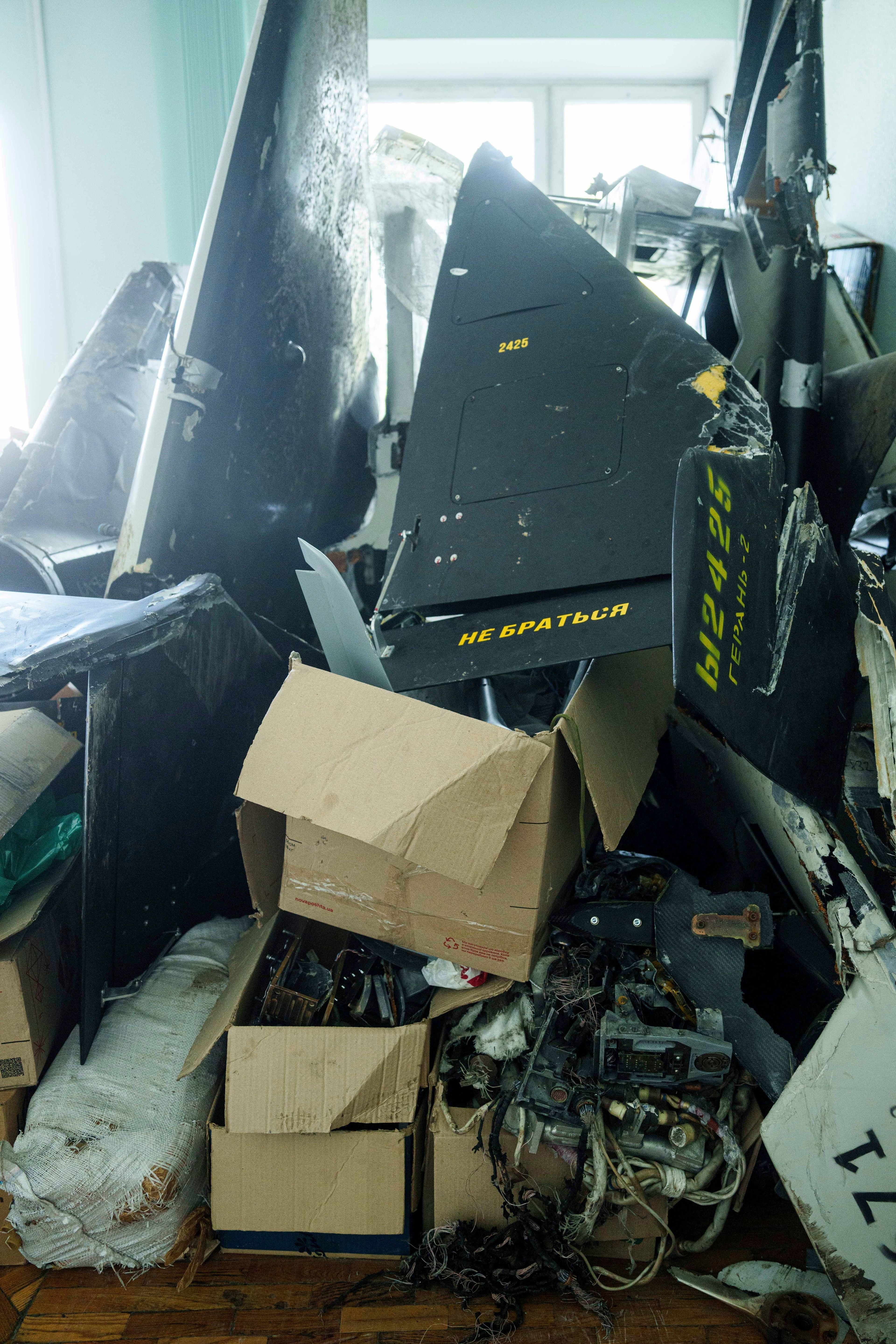 Parts of downed Shahed drones launched by Russia are piled in a storage room of a research laboratory in Kyiv, Ukraine, on Aug. 28, 2024. (AP Photo/Evgeniy Maloletka)