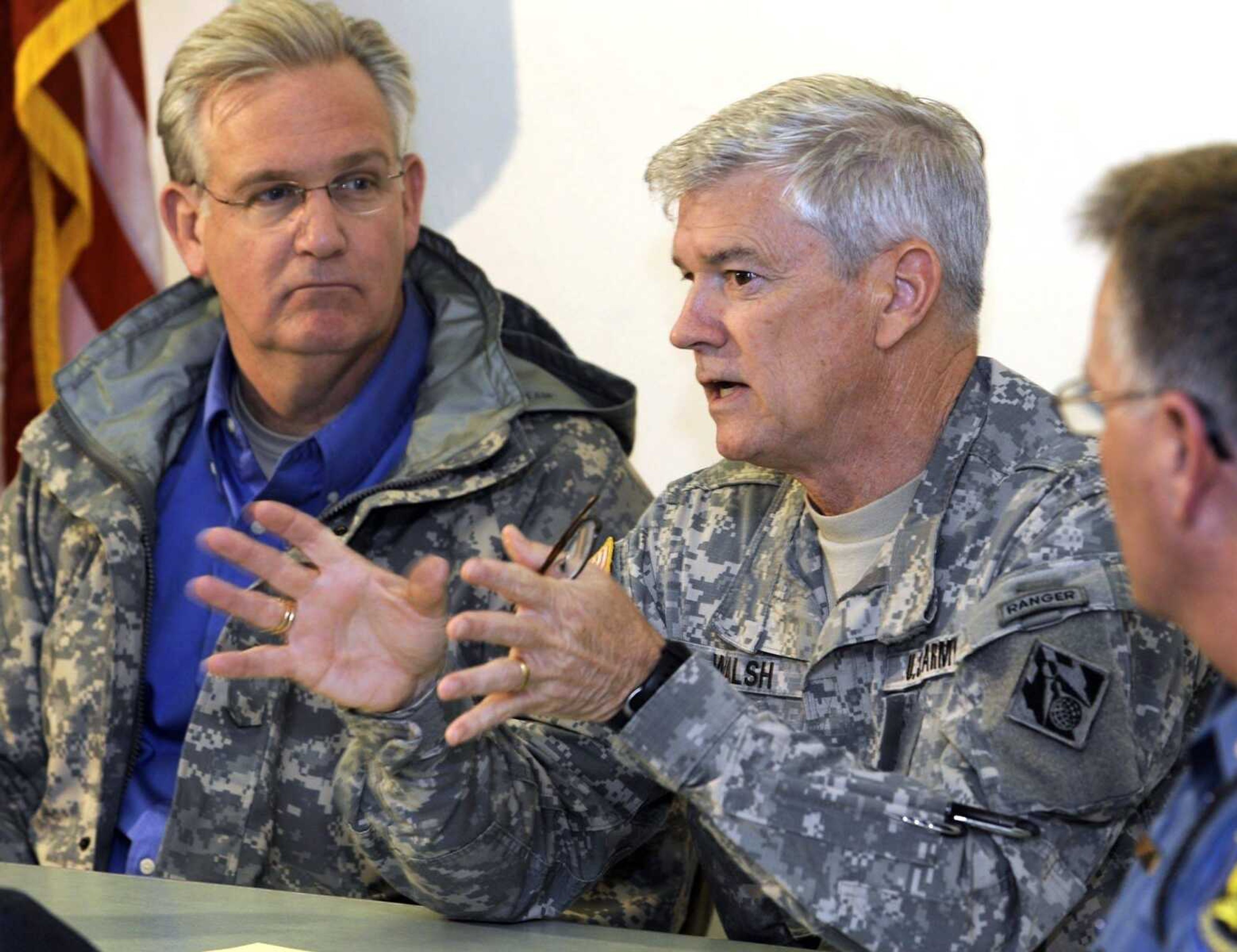 Maj. Gen. Michael Walsh, right, speaks at a news conference with Gov. Jay Nixon Tuesday, May 3, 2011 in Sikeston, Mo. (Fred Lynch)