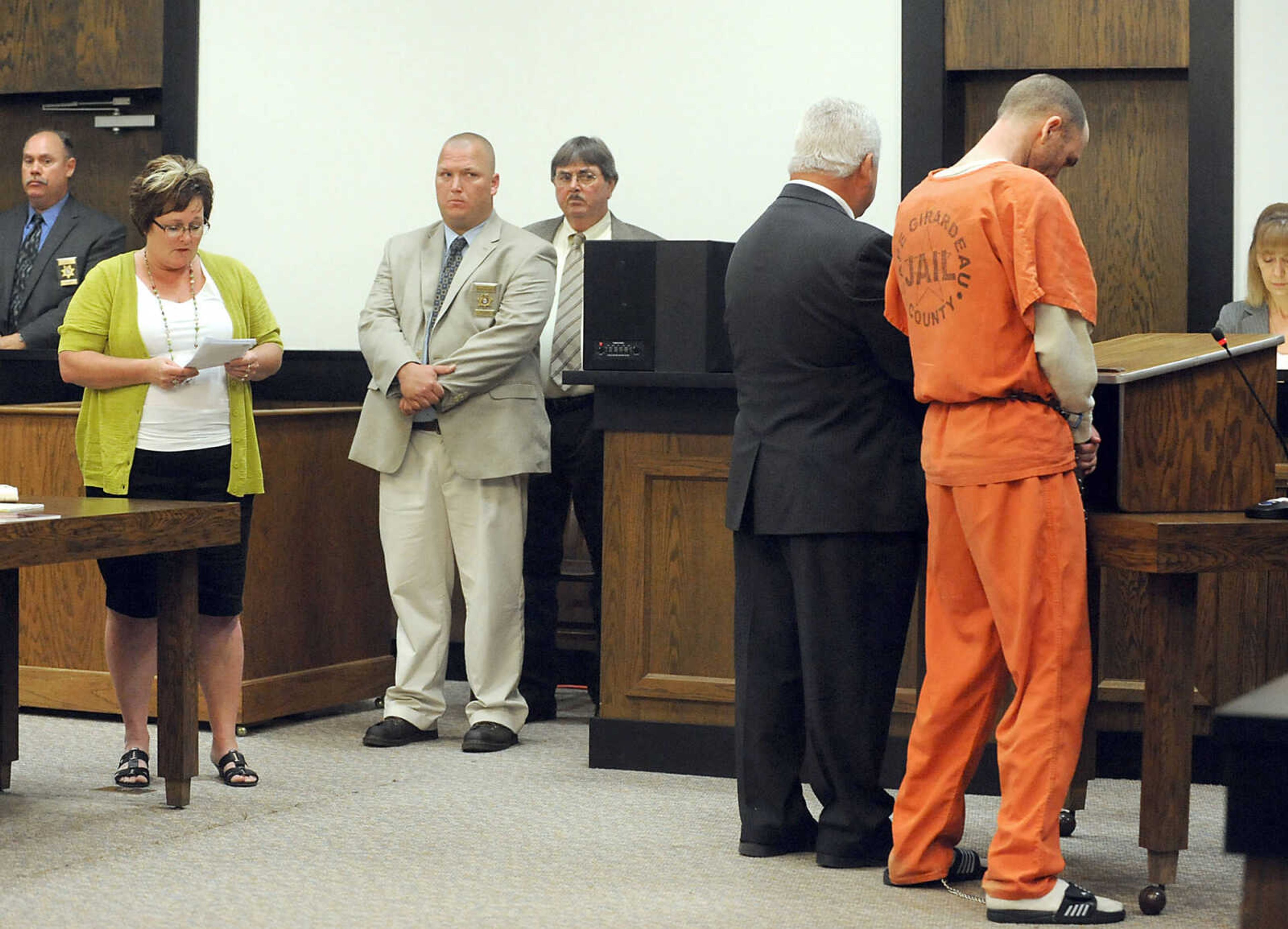 LAURA SIMON ~ lsimon@semissourian.com 
Clay Waller hangs his head as Cheryl Brenneke gives her victim impact statement, Thursday, June 6, 2013, at the Cape Girardeau County Courthouse. Waller pleaded guilty to second-degree murder for the death of Brenneke's sister, Jacque Waller. Jacque Waller went missing June 1, 2011. Her body was found last Wednesday in Southern Illinois.