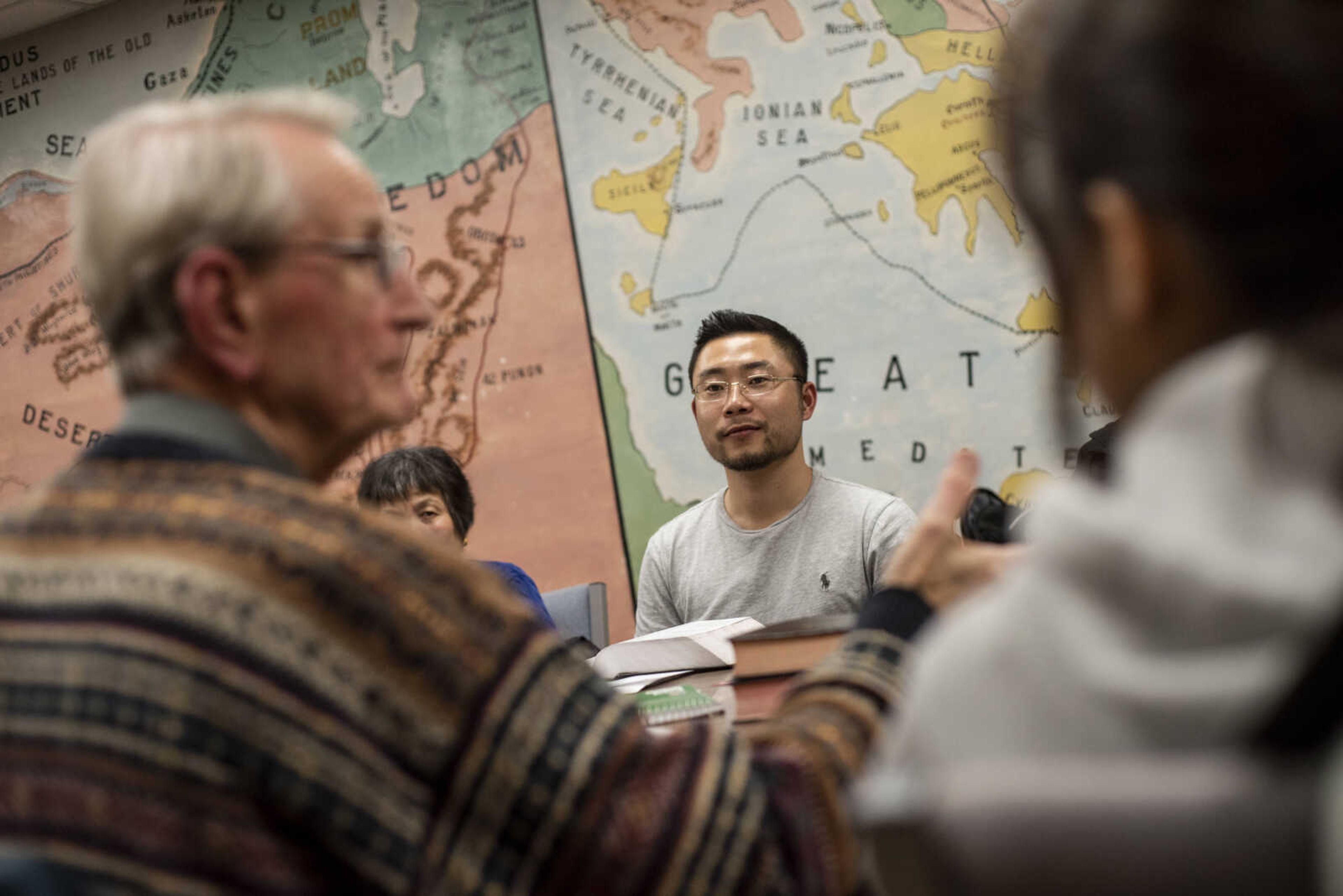 Pu (Paul) Xiao listens as Dr. Ron Winstead leads the weekly Bible study in Mandarin and English Friday, March 8, 2019, at the Southeast Missouri State University Baptist Student Center in Cape Girardeau.