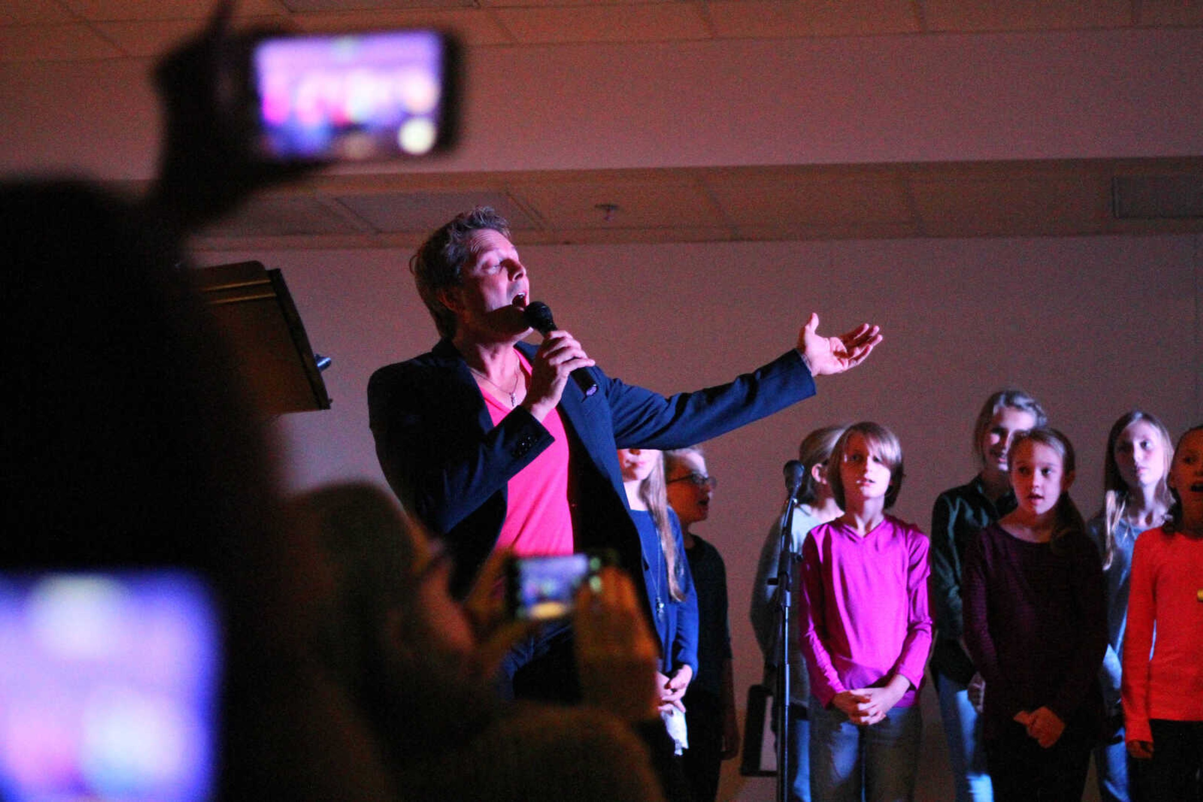 Singer Steph Carse and the Immaculate Conception School Choirsters sing Leonard Cohen's "Hallelujah" during an anti-bullying benefit concert at the Osage Center on November 13, 2016.