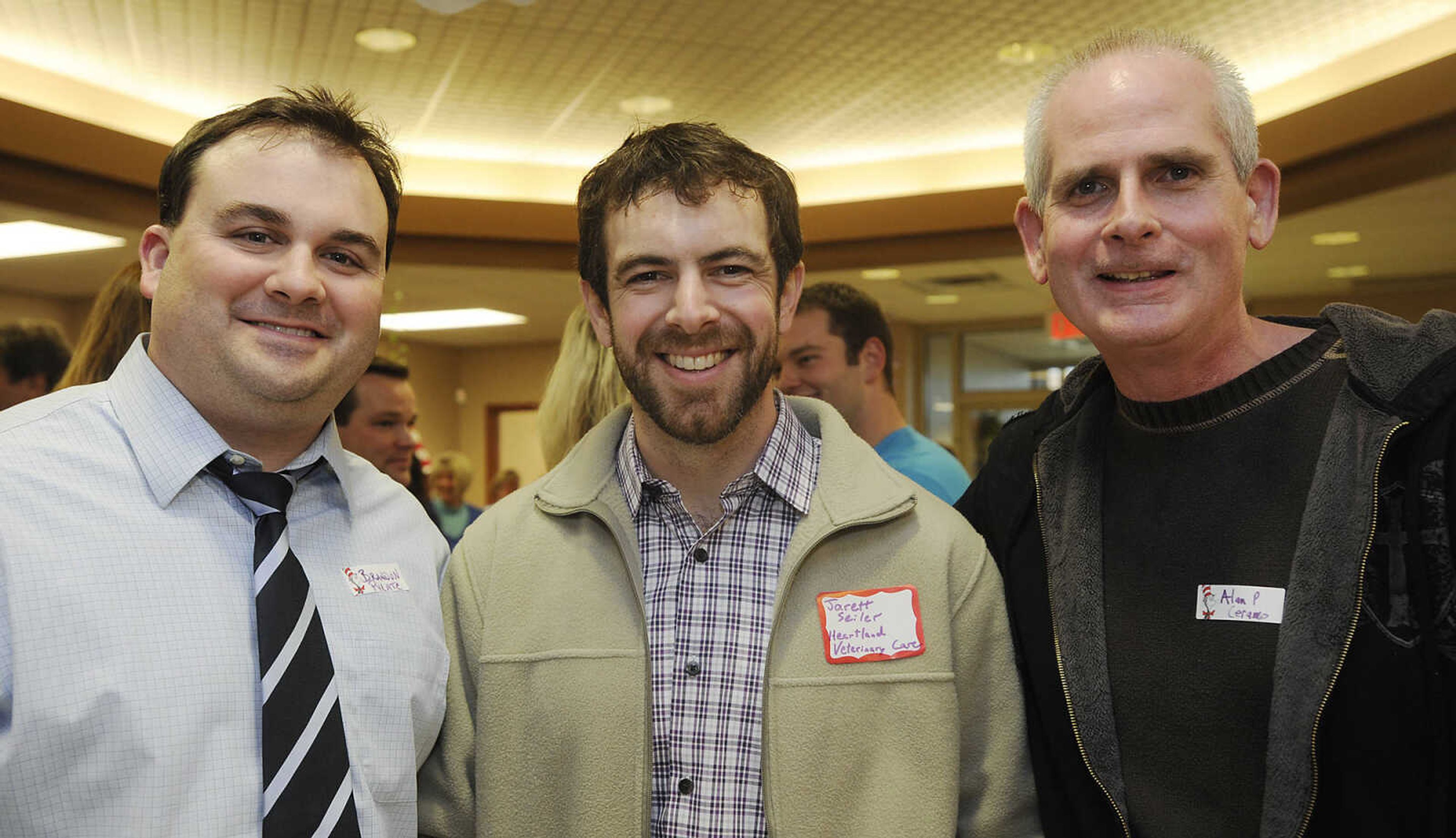 Brandon Pylate of Montgomery Bank, left, Jarett Seiler of Heartland Veterinary Care and Alan Pendergrass of Ceramo at the Jackson Chamber of Commerce after hours event Tuesday, March 12, at The Bank of Missouri.