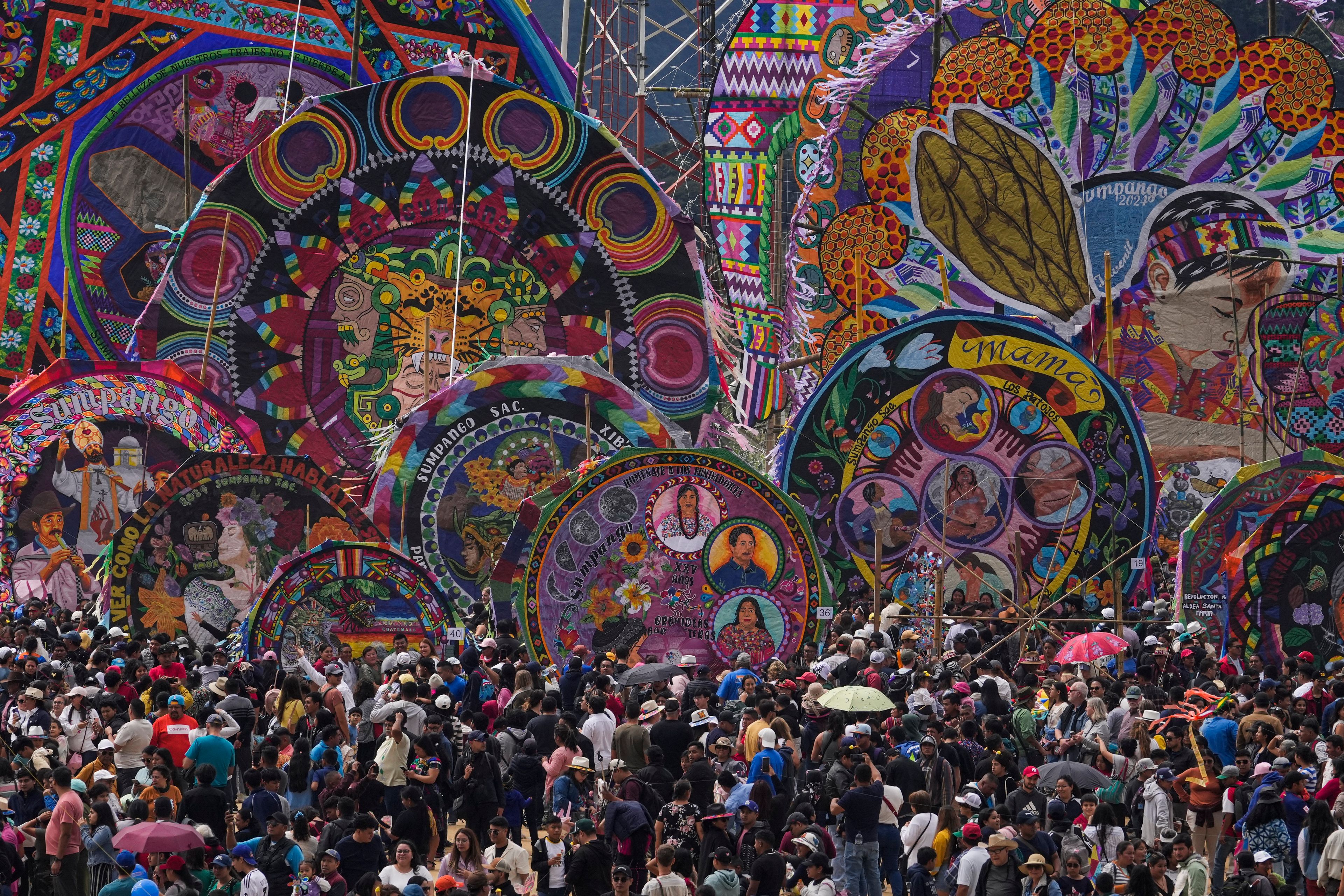 Kites are displayed for All Saints Day in Sumpango, Guatemala, Friday, Nov. 1, 2024, as part of Day of the Dead celebrations. (AP Photo/Matias Delacroix)