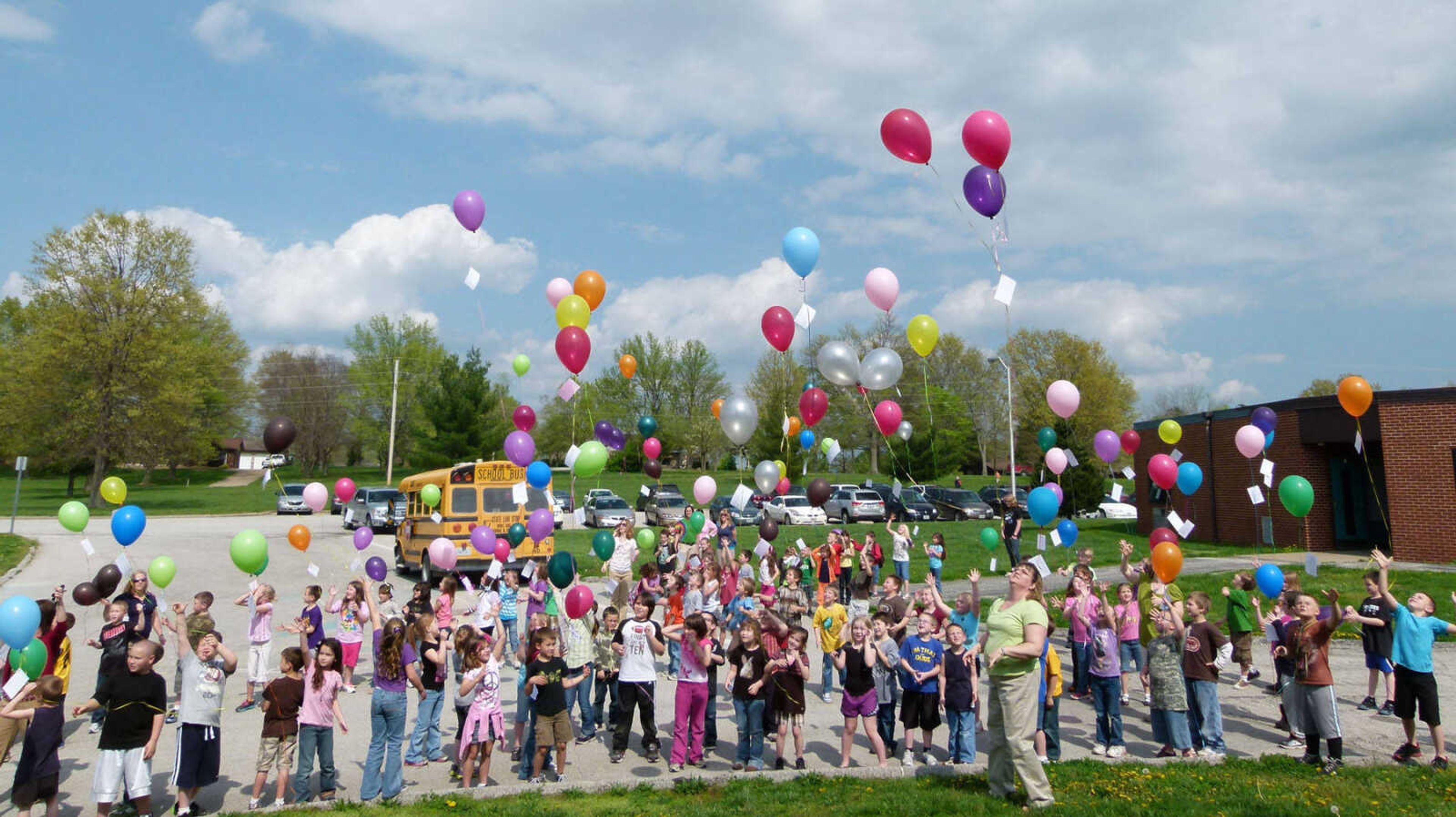 The balloons and the children’s wishes are up, up and away. The students hope their wishes are found and that the finders write to them to let them know how far their balloons traveled.