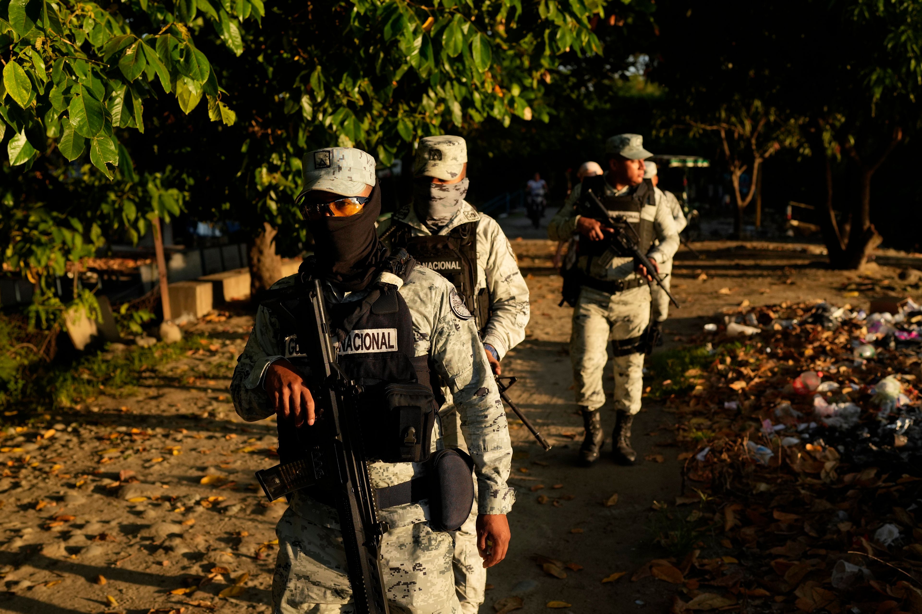 Police officers patrol an area next to Suchiate River in Ciudad Hidalgo, Mexico, on the border with Guatemala, Monday, Oct. 28, 2024. (AP Photo/Matias Delacroix)