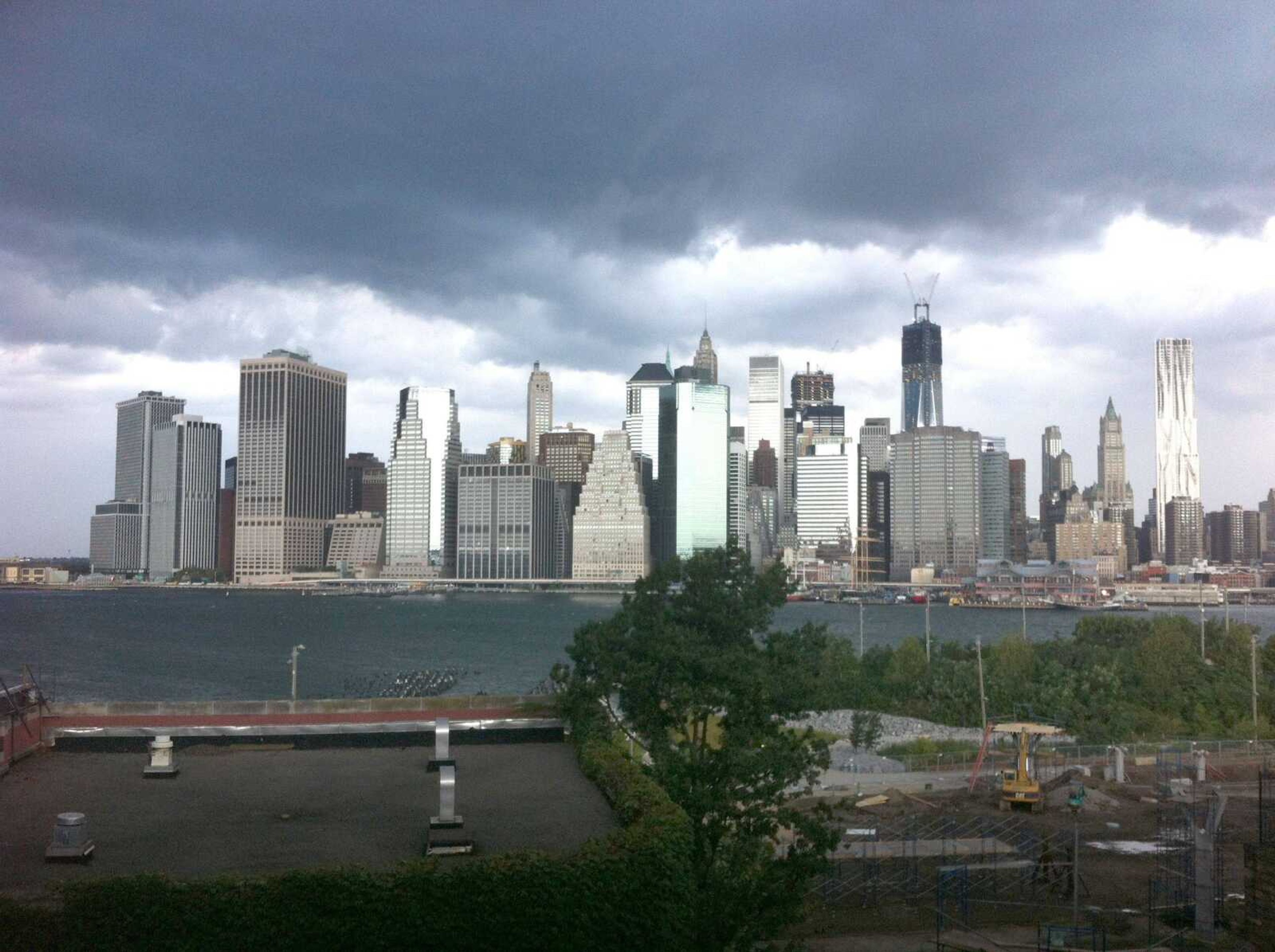 Dark clouds loom over the skyline Saturday in New York. Two tornadoes struck New York City on Saturday. One swept out of the sea and hit a beachfront neighborhood and the second, stronger twister hit moments later, hurling debris in the air, knocking out power and startling residents who once thought of twisters as a Midwestern phenomenon. (Jake Dobkin ~ Gothamist)