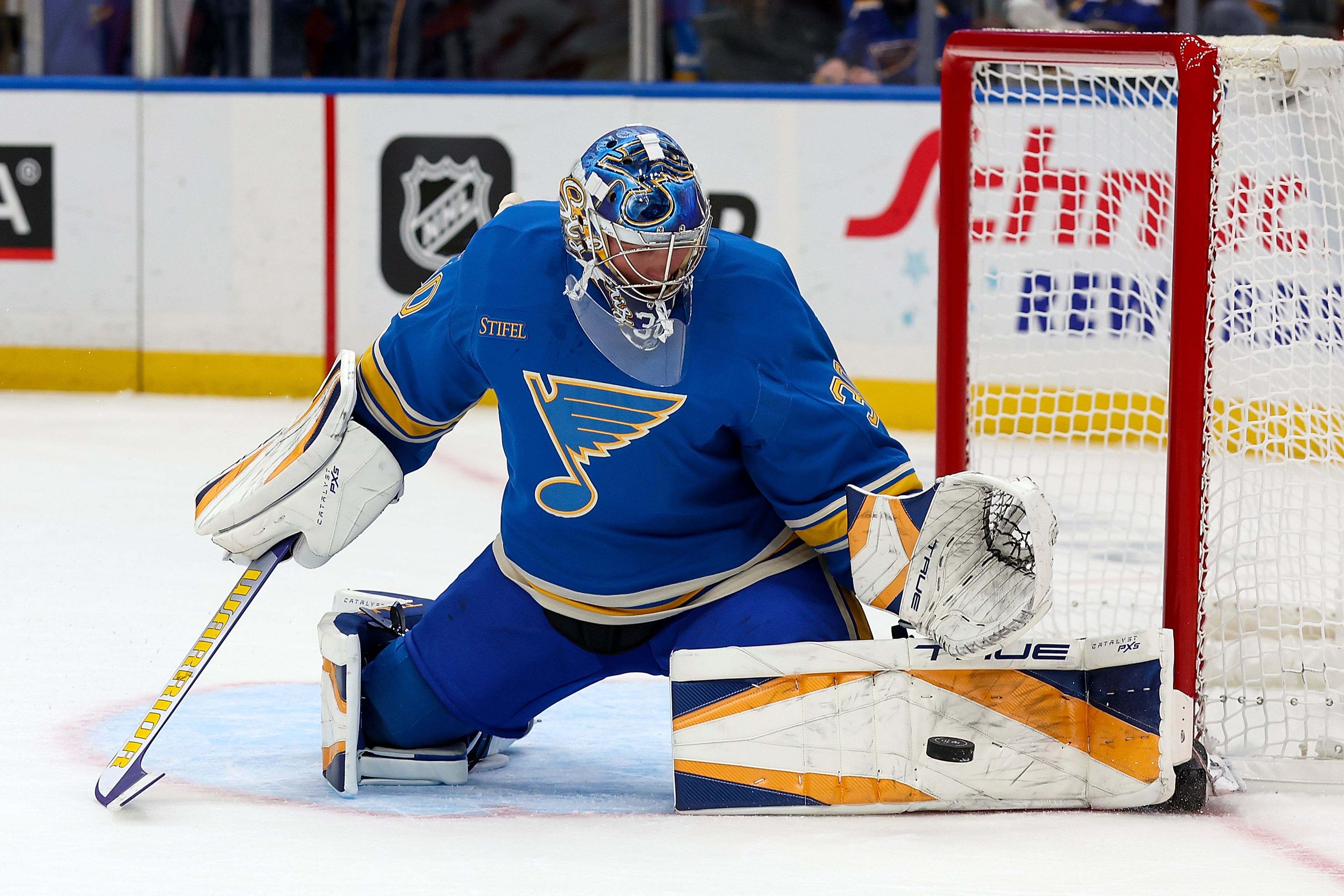 St. Louis Blues goaltender Joel Hofer (30) defends the goal during the first period of an NHL hockey game against the Carolina Hurricanes Saturday, Oct. 19, 2024, in St. Louis. (AP Photo/Scott Kane)