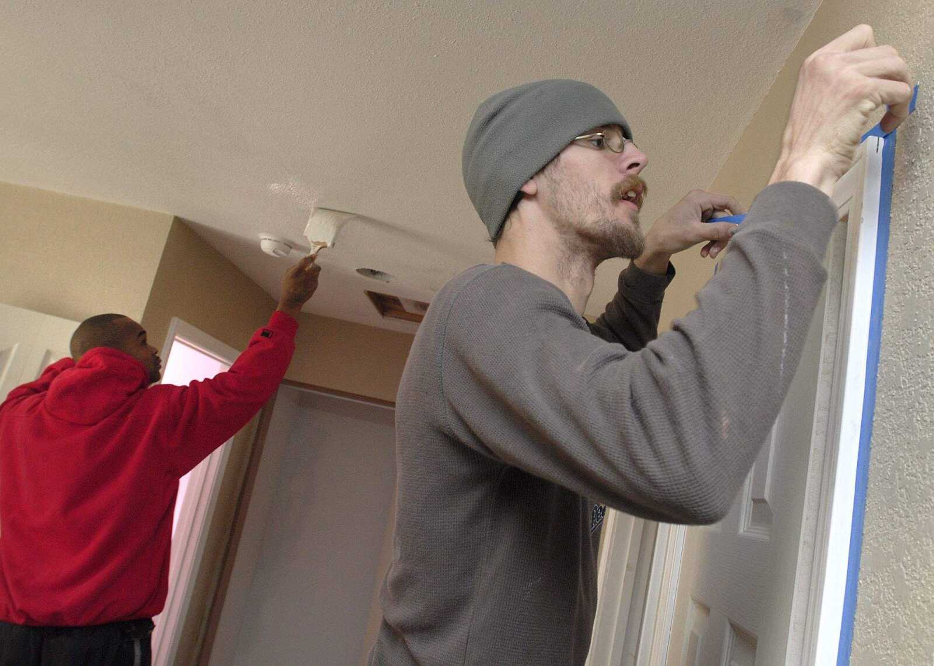 FRED LYNCH ~ flynch@semissourian.com
Brandon Franklin, right, and Mike Bell work inside a nearly-finished Habitat for Humanity house Saturday in Cape Girardeau.