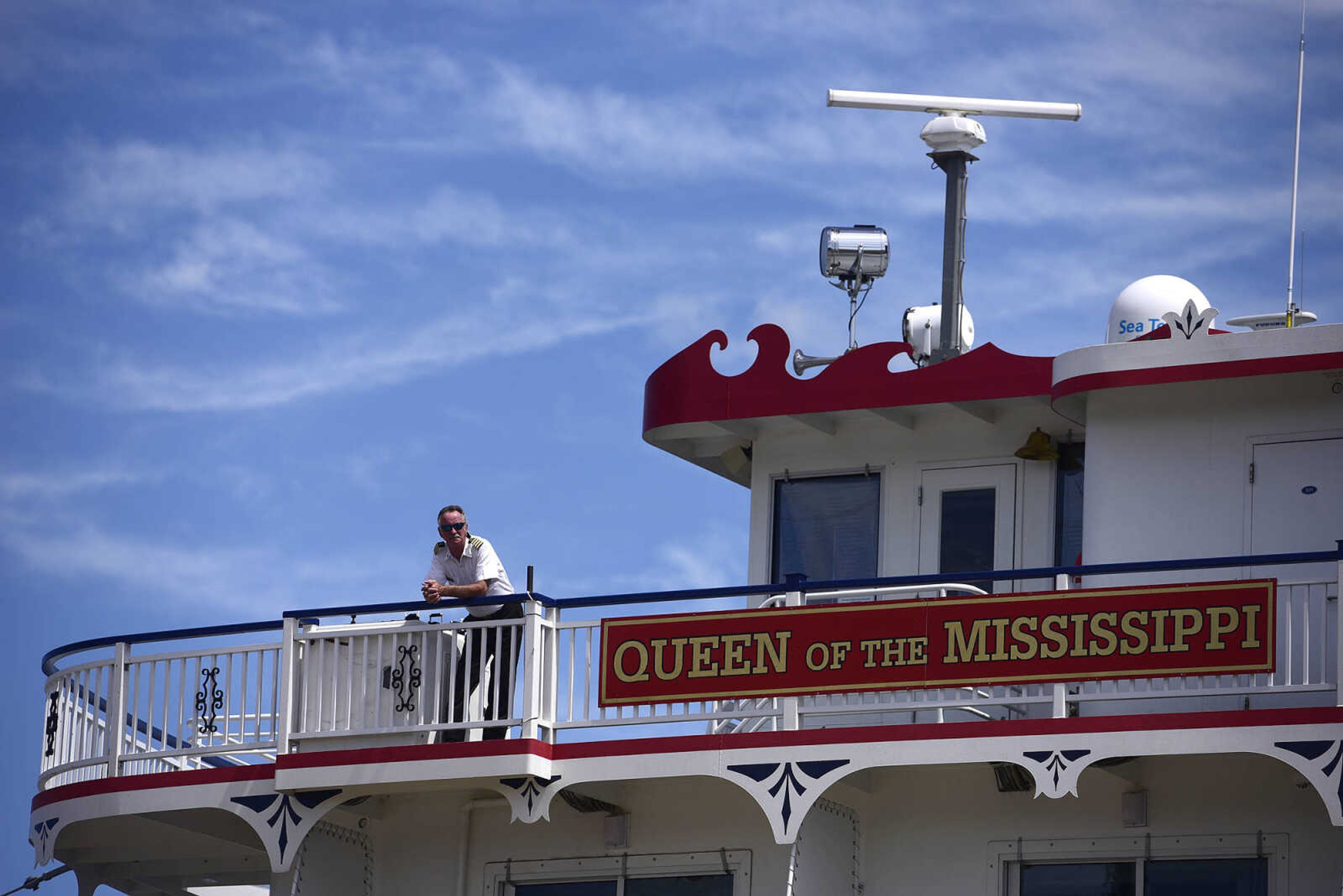 A crew member on the Queen of the Mississippi takes in the view of Riverfront Park on Wednesday, Aug. 23, 2017, in downtown Cape Girardeau.