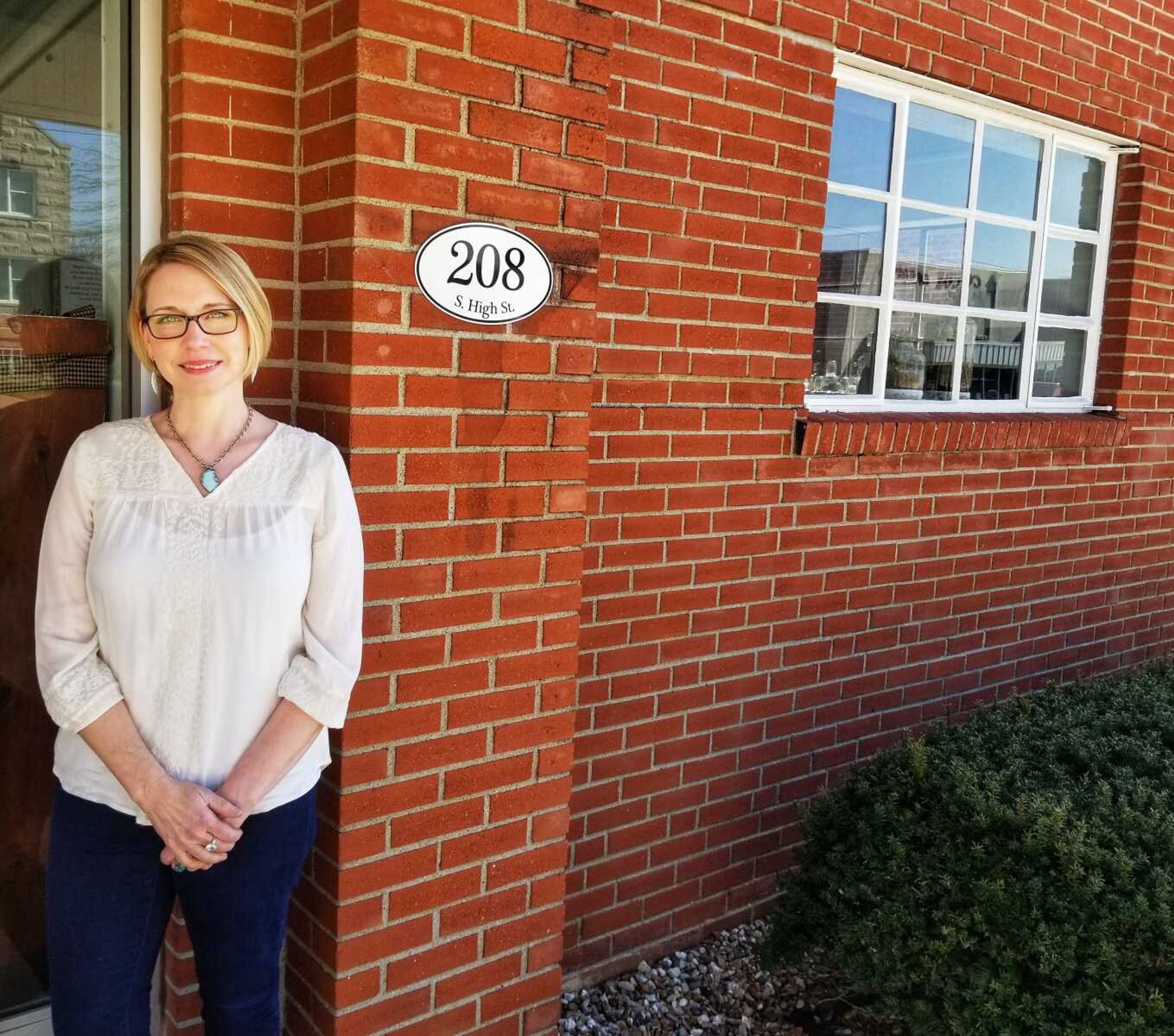 Foxy Lady Stuff, a shop featuring handcrafted jewelry, is at 208 S. Main St. in Jackson. Emily Fulenwider Fox, the proprietor, stands in front of the building, which has been in her family for three generations.