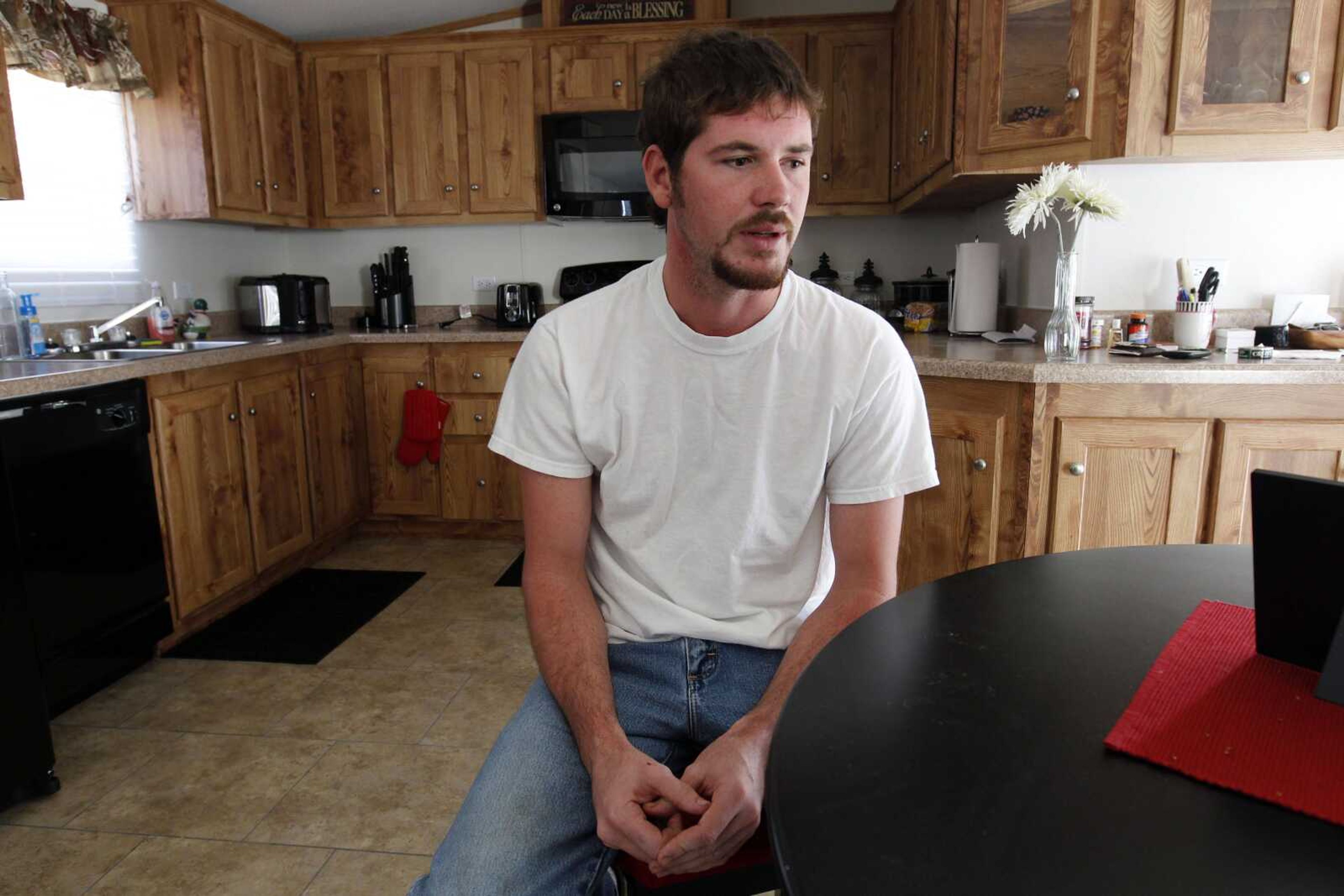 Justin Barker, the student who was beaten by six black schoolmates in Jena, La., in 2006, speaks during an interview Aug. 17 at his home in Trout, La. (Gerald Herbert ~ Associated Press)