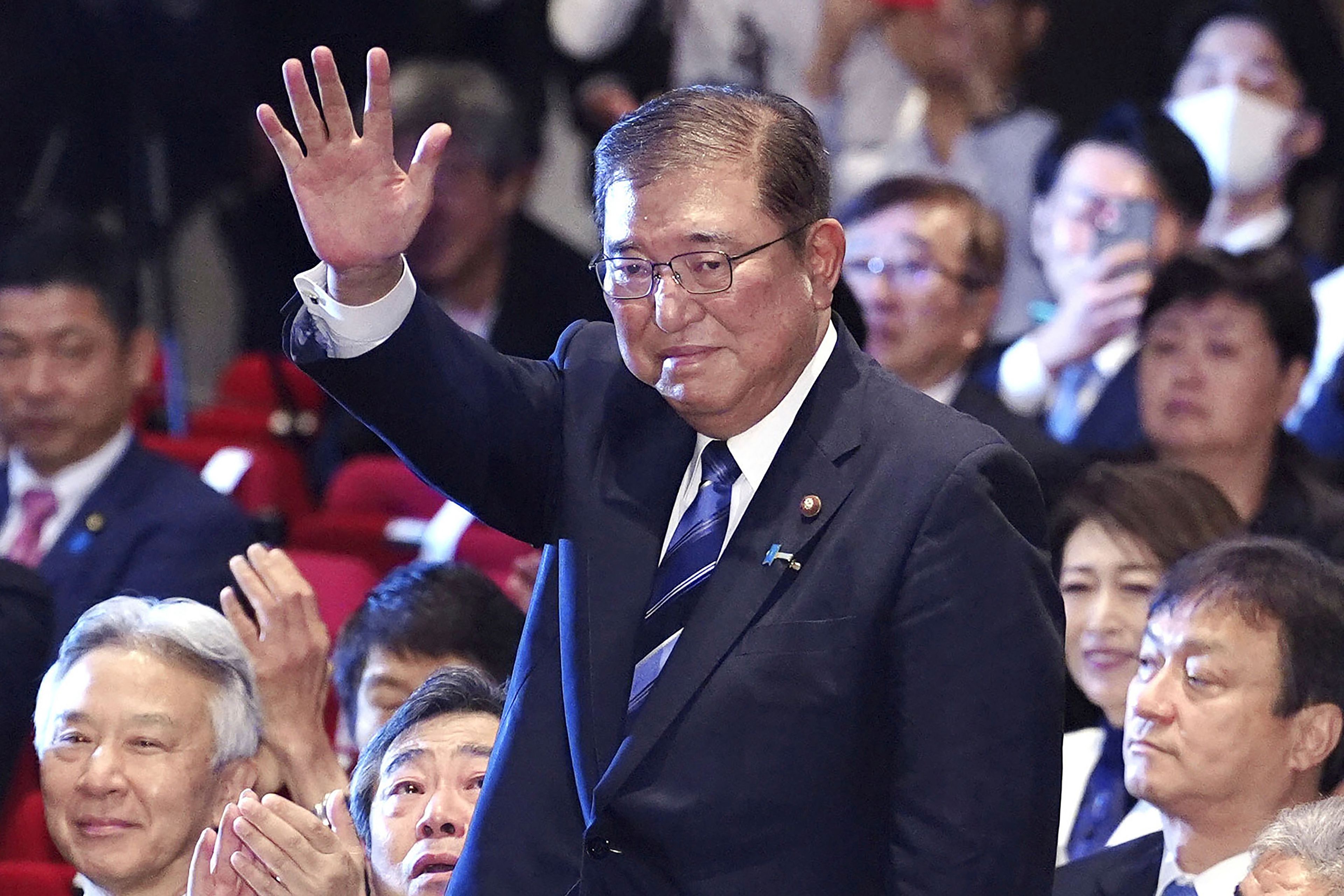 Shigeru Ishiba, center, waves as he is elected as leader of the ruling Liberal Democratic Party after the party's leadership election, in Tokyo Friday, Sept. 27, 2024. (Kyodo News via AP)