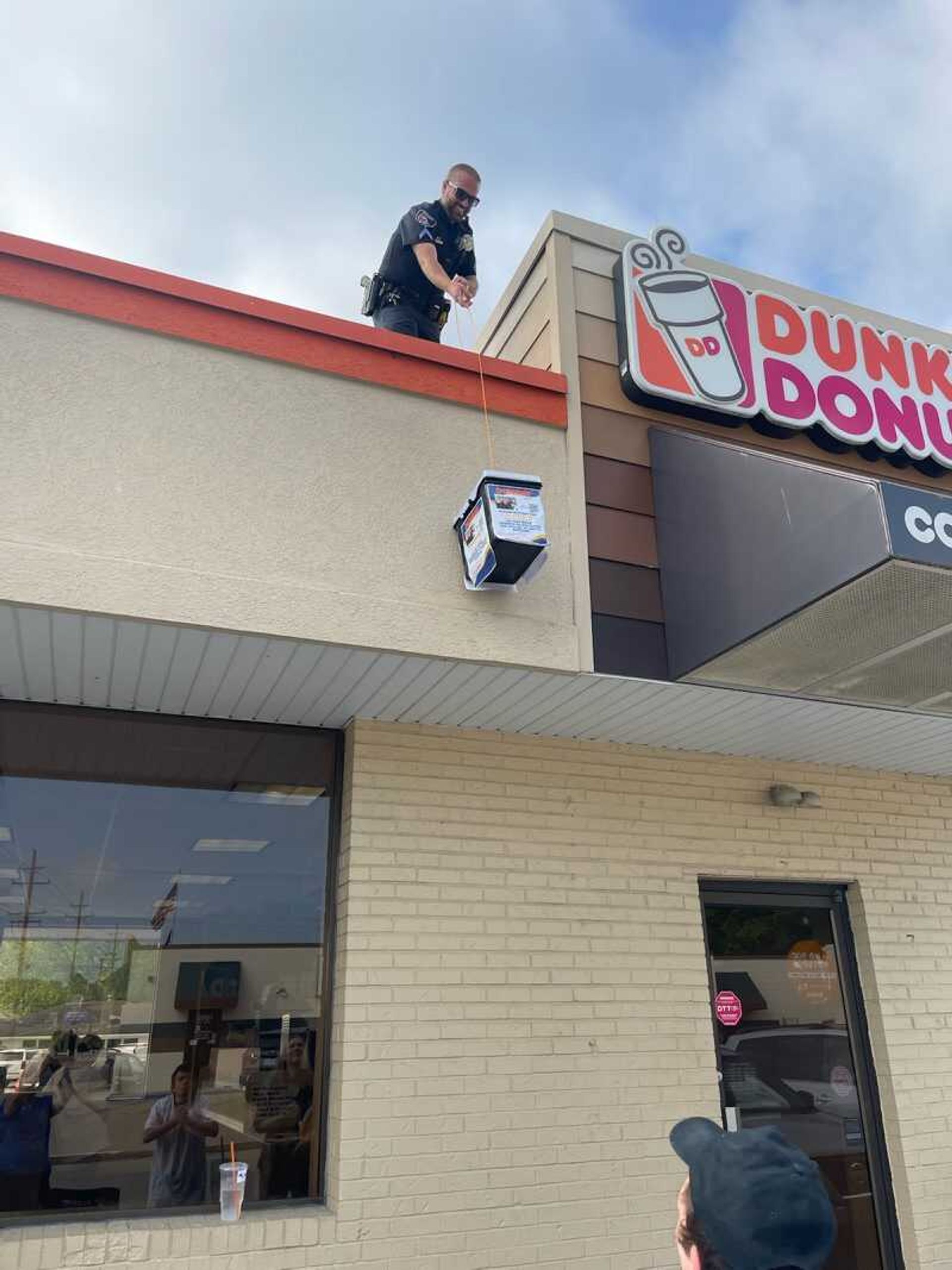 Cpl. Johnny Spencer takes part in Cop on a Rooftop, a fundraiser for Special Olympics.