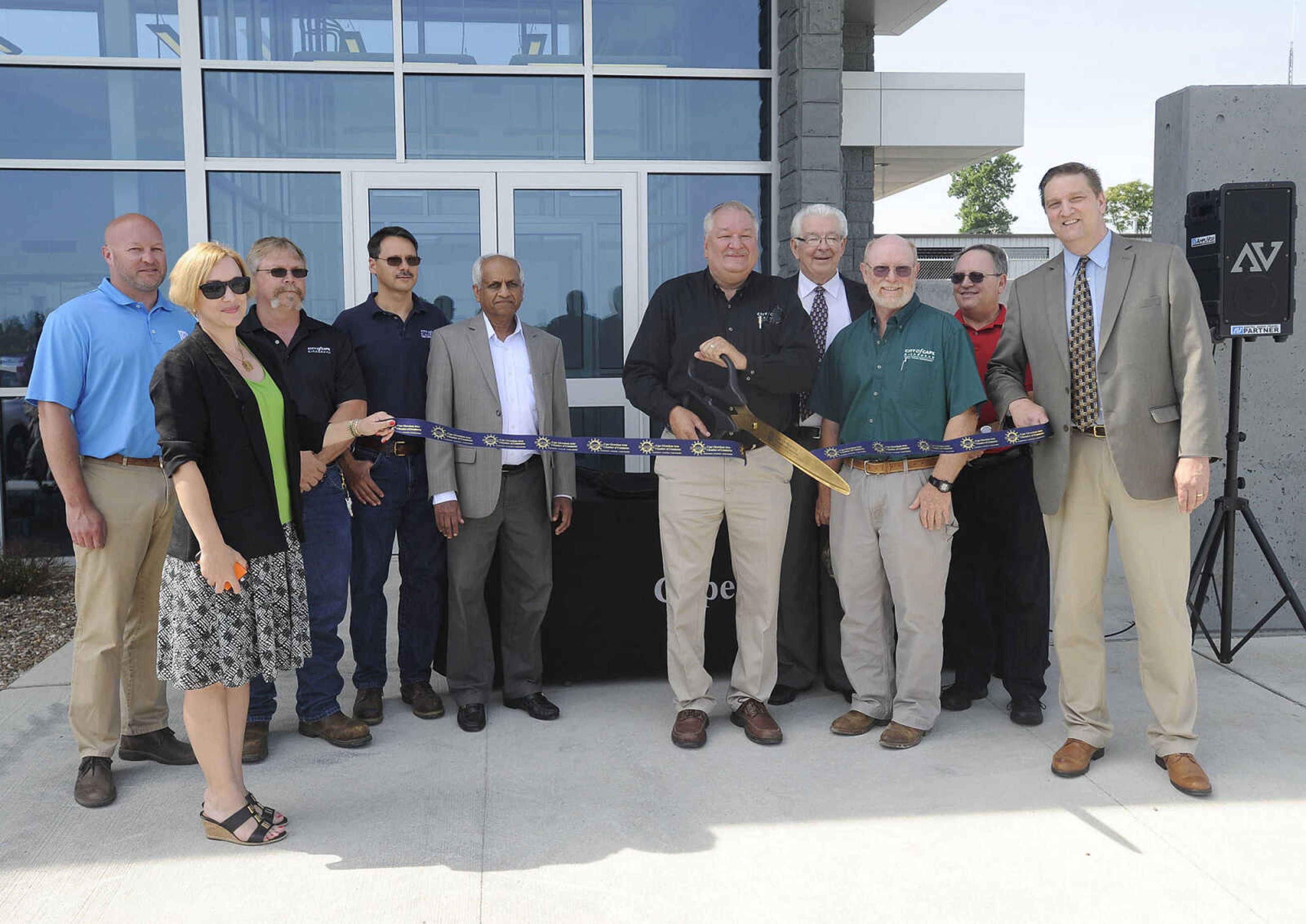 Public works director Steve Cook cuts the ribbon at the new wastewater treatment facility Monday, May 23, 2016 in Cape Girardeau. From left are Tom Hustler, KCI Construction; deputy city manager Molly Hood, chief wastewater operator Quentin Overbeck, wastewater plant manager Todd Fulton, PK Mathai of Jacobs Engineering, Cook, Mayor Harry Rediger, public works assistant director Stan Polivick, Mayor Pro-Tem Victor Gunn and City Manager Scott Meyer.