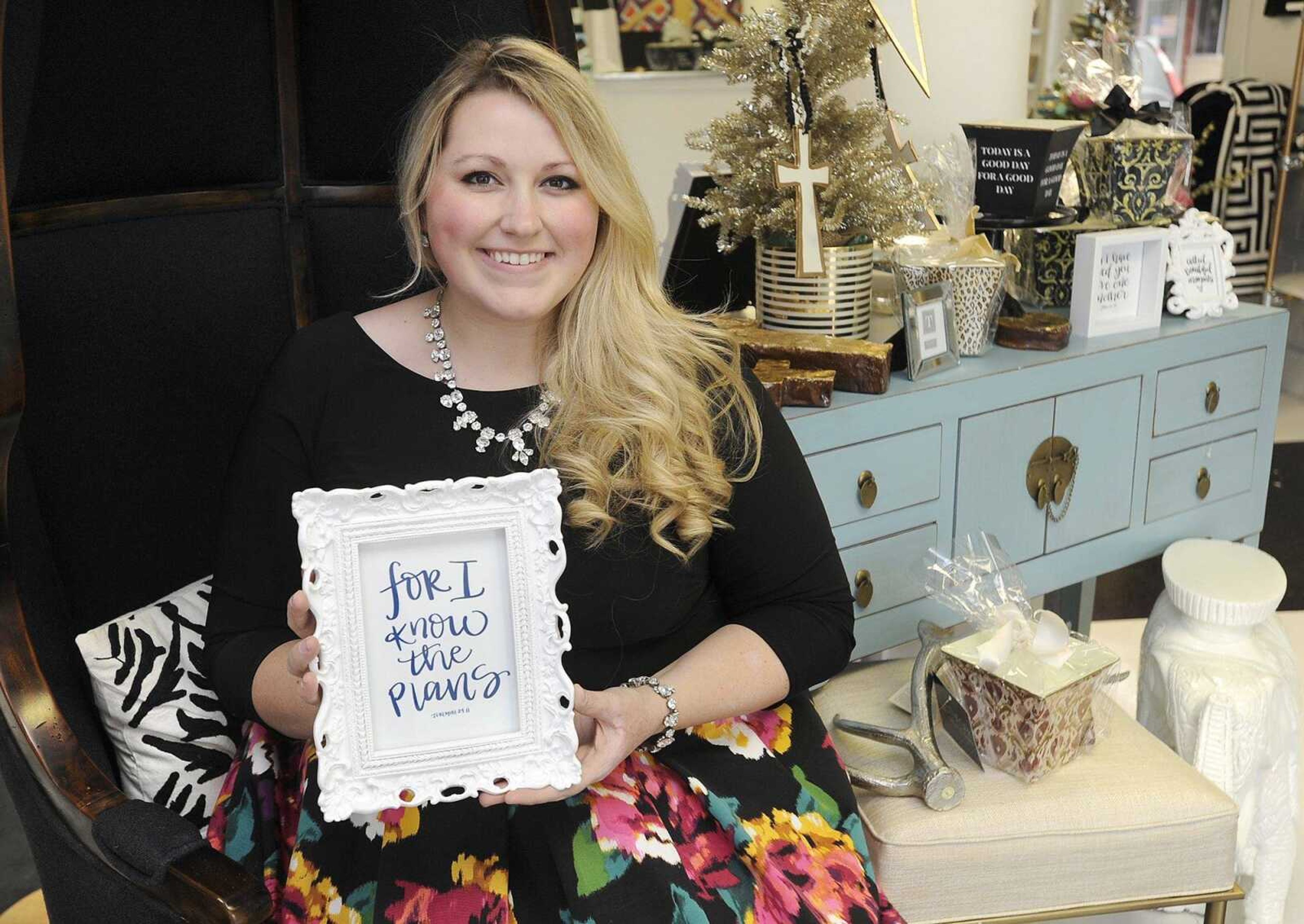 Mollie Young shows an example of her calligraphy Friday at her boutique, Mollie Paperie, 2121 Broadway in Cape Girardeau.