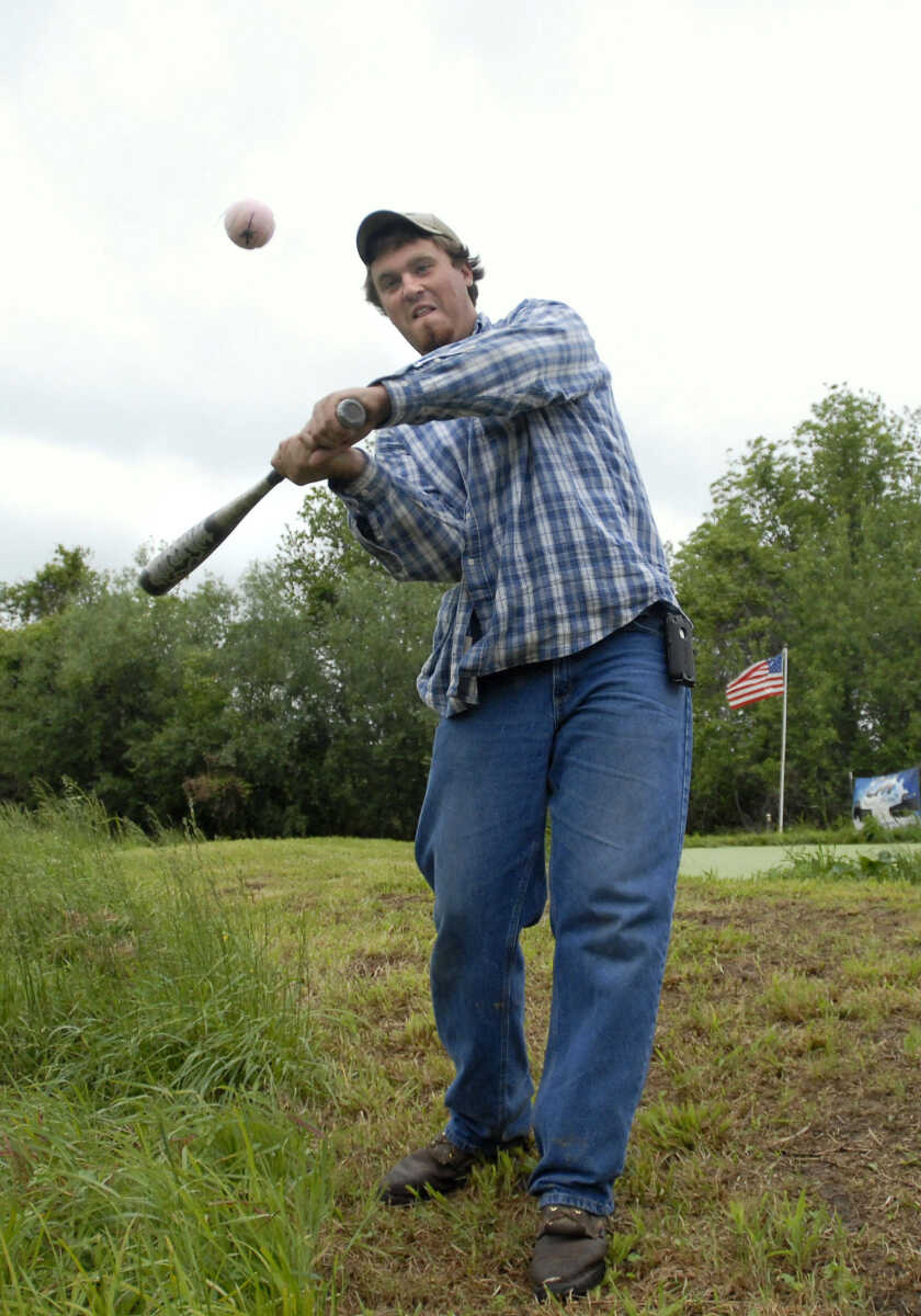 KRISTIN EBERTS ~ keberts@semissourian.com

Dylan Schweer uses a baseball bat to hit the ball during the Kow Pasture Klassic at Schlinder's Tavern in New Hamburg, Mo., on Saturday, May 14, 2011. Proceeds from the event benefit the Kenny Rogers Children's Center and the Missouri Veterans Home.