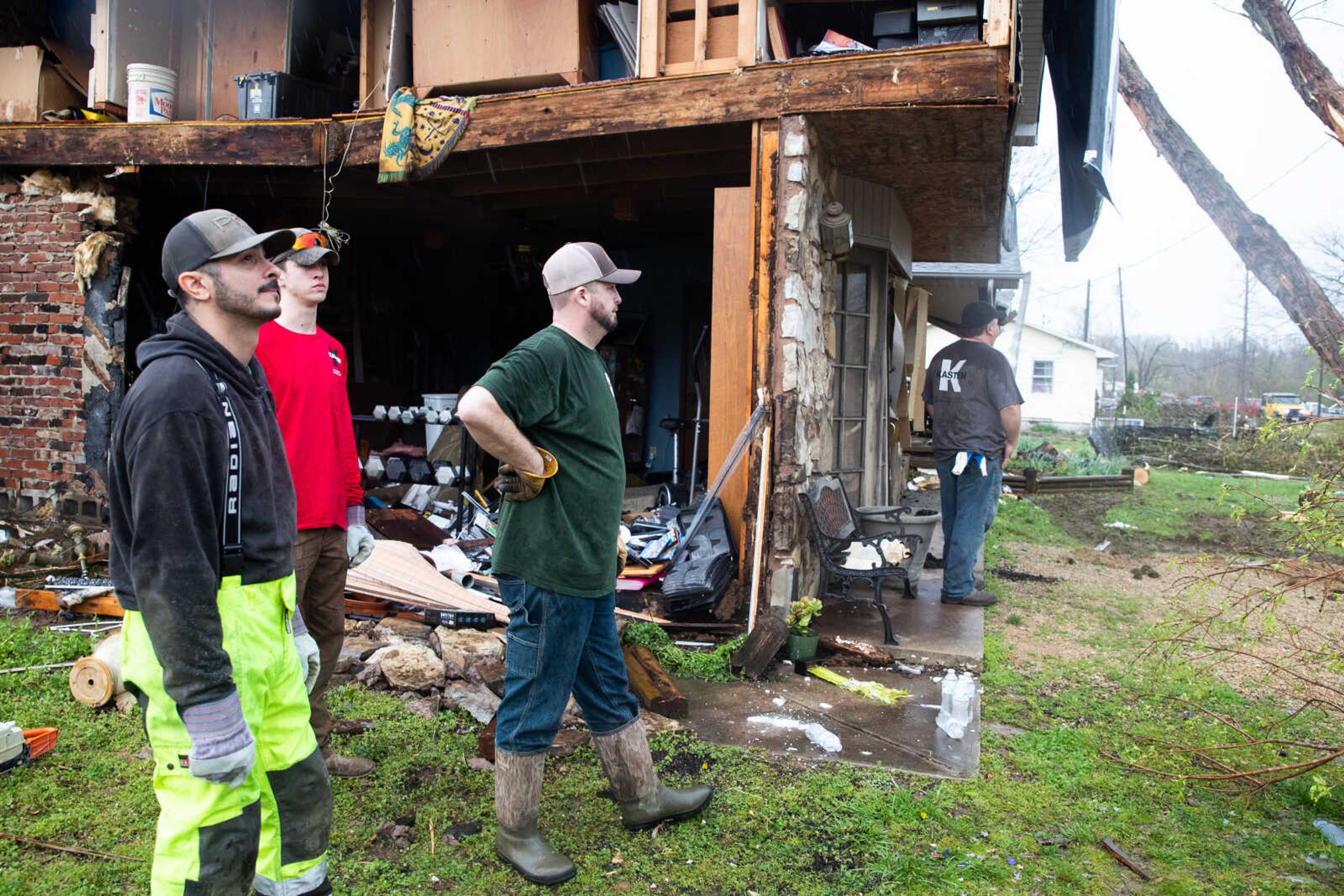 Miguel Echeuarria,&nbsp;Cole Vermillion,&nbsp;Daniel Cook and Steve Phelps volunteer to clear trees and other debris.