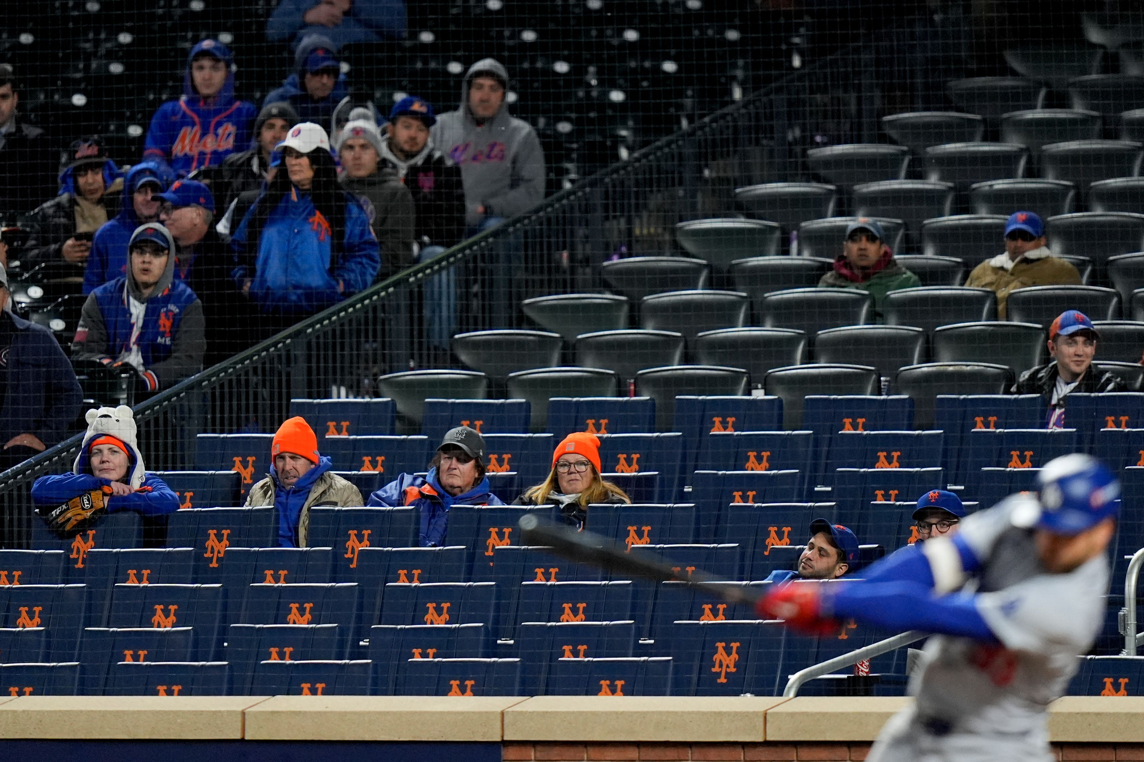 New York Mets fans watches during their loss against the Los Angeles Dodgers in Game 4 of a baseball NL Championship Series, Thursday, Oct. 17, 2024, in New York. (AP Photo/Frank Franklin II)