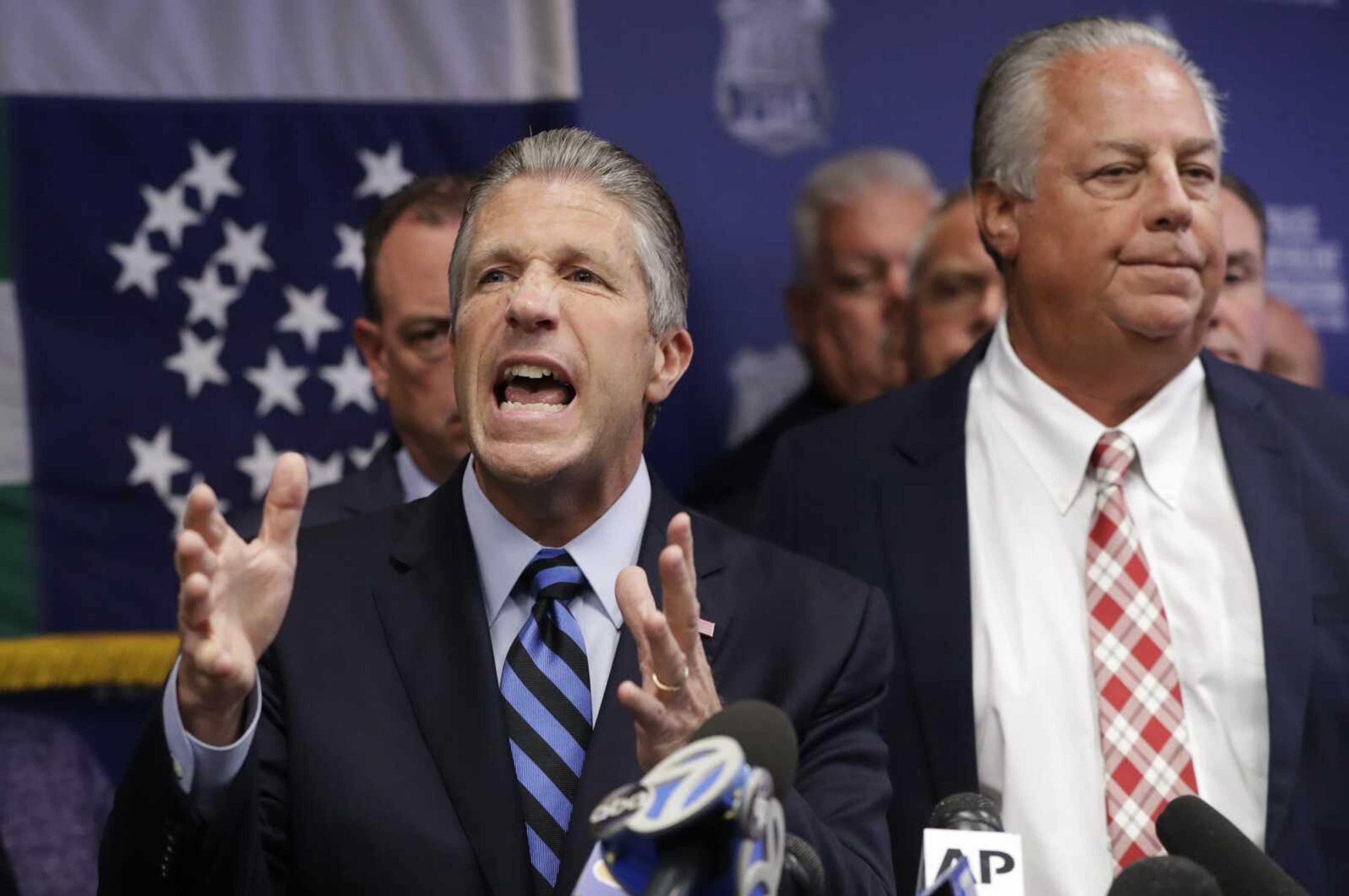 Patrolmen's Benevolent Association President Patrick J. Lynch, left, speaks next to New York Police Department Officer Daniel Pantaleo's attorney Stuart London, right, during a news conference at PBA headquarters following a decision to terminate Pantaleo, Monday, Aug. 19, 2019, in New York. Pantaleo was involved in the chokehold death of Eric Garner. (AP Photo/Kathy Willens)