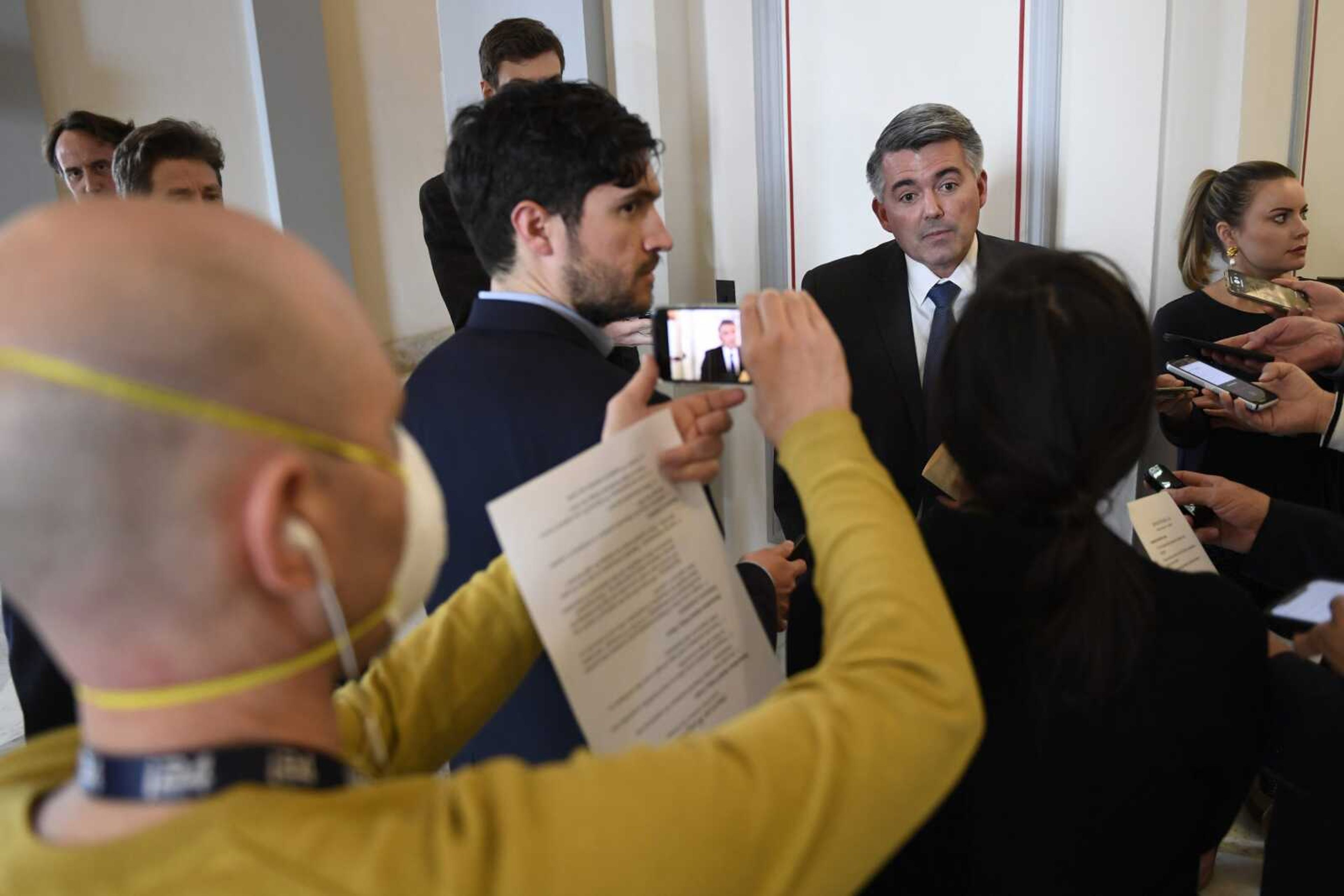 Sen. Cory Gardner, R-Colo., talks with reporters Tuesday as he heads to the weekly Republican policy lunch on Capitol Hill in Washington.