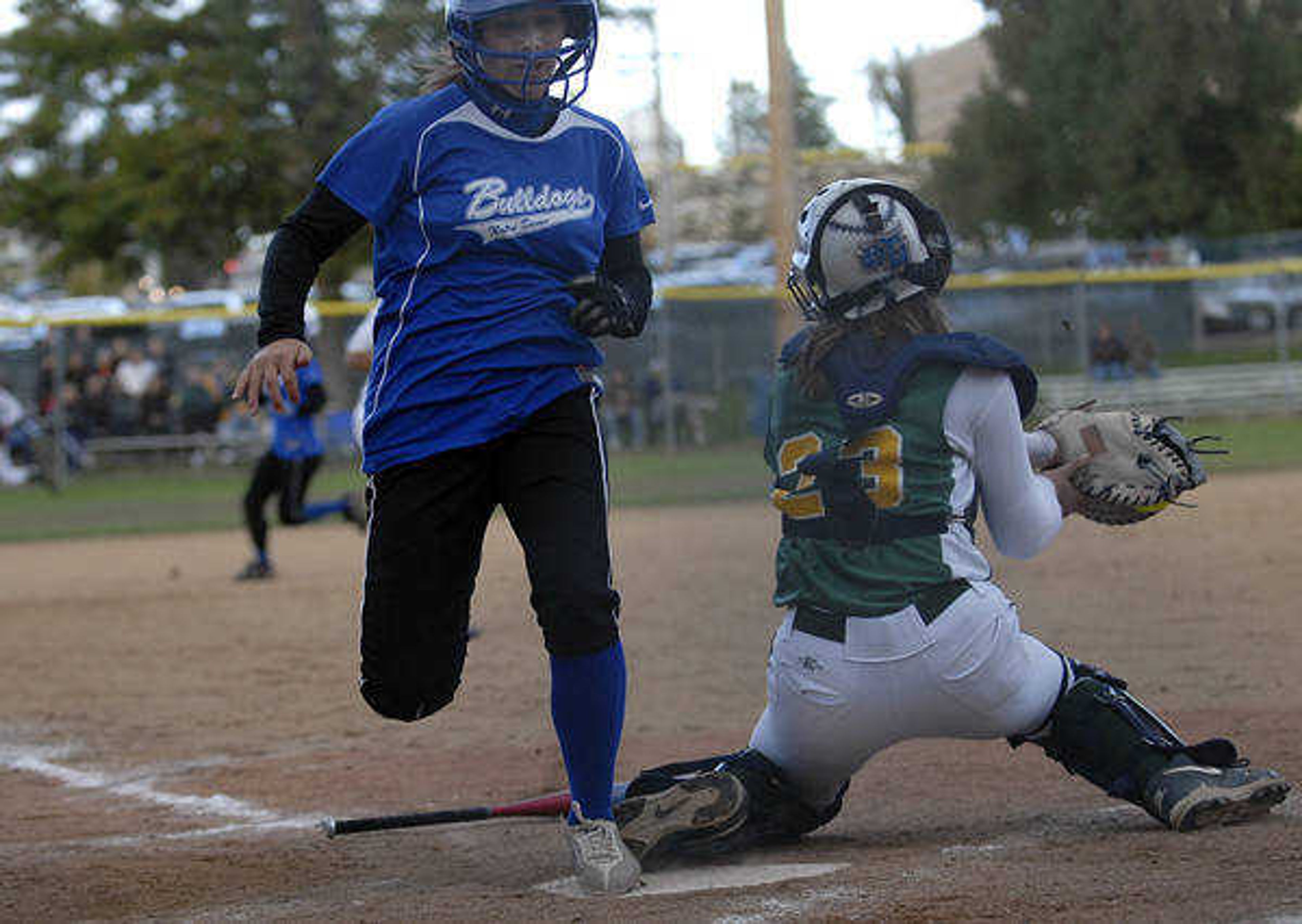 KIT DOYLE ~ kdoyle@semissourian.com
Notre Dame's Hali Rendleman scores on a squeeze play bunt by Jane Morrill Saturday afternoon, October 17, 2009, in Ballwin.