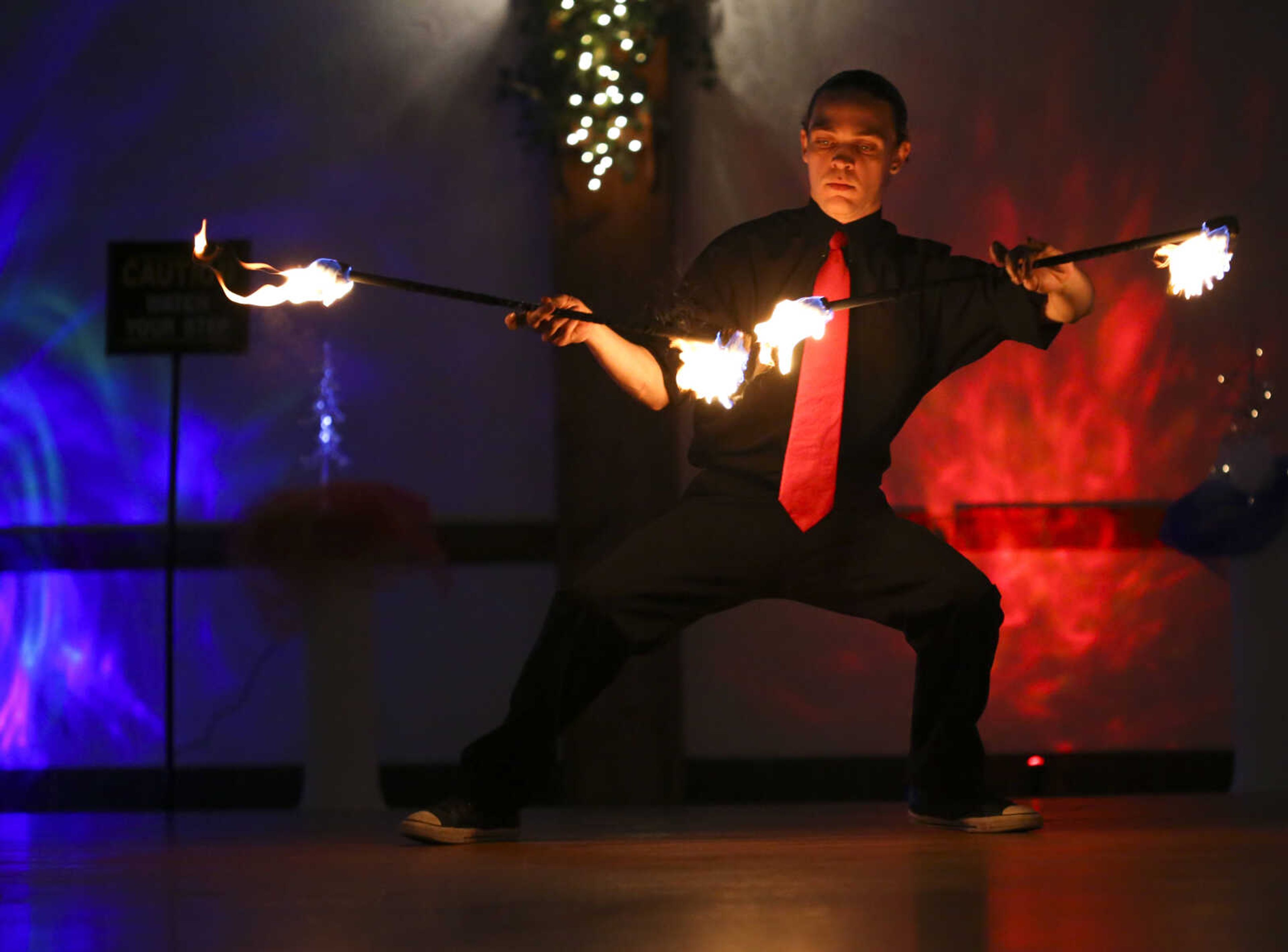 Ezra Caldwell twirls fire Saturday, Feb. 3, 2018, during the Fire and Ice Gala at Bavarian Halle in Jackson.