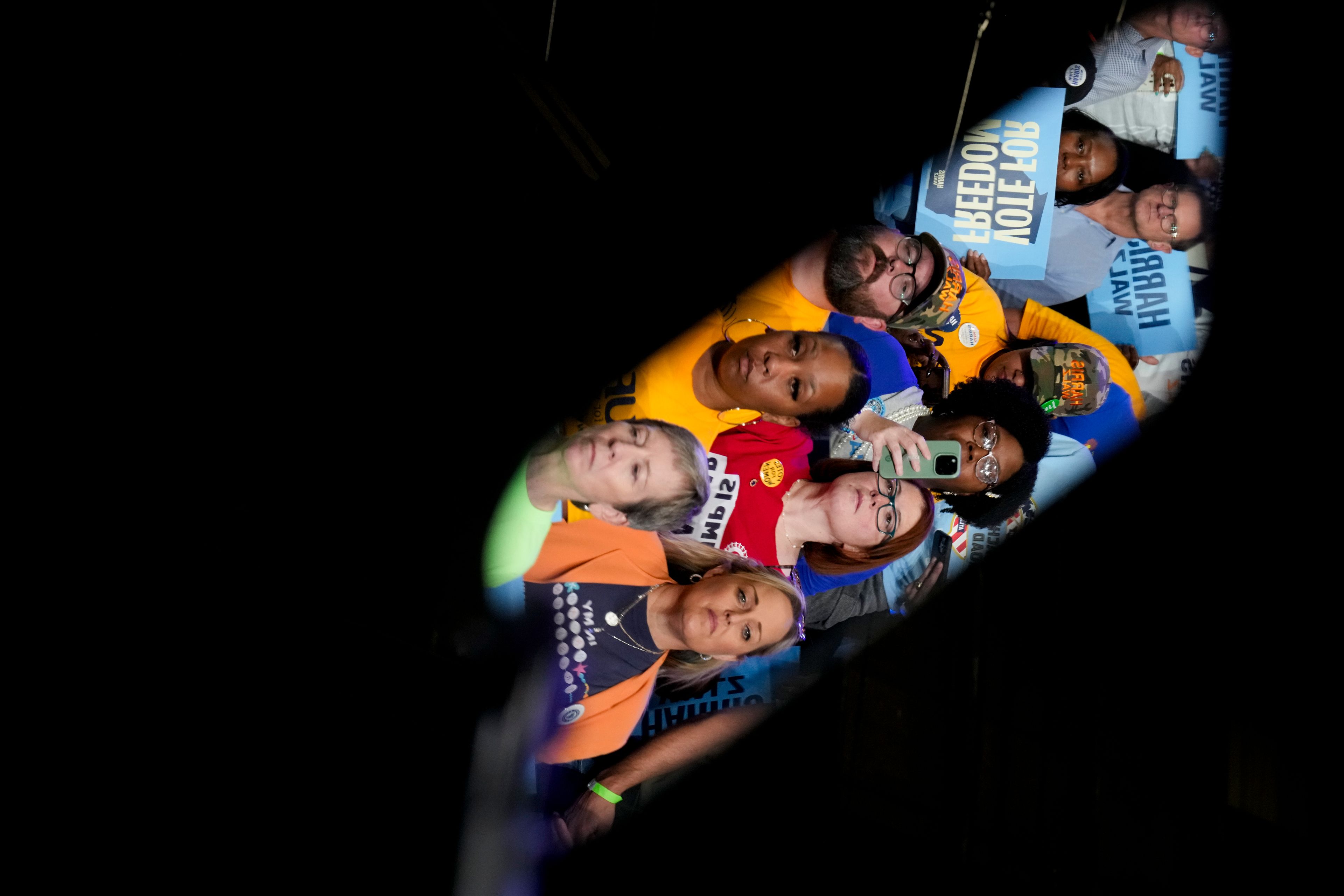 Members of the crowd are reflected on a teleprompter as Democratic presidential nominee Vice President Kamala Harris speaks during a campaign event at Lakewood Amphitheatre, Saturday, Oct. 19, 2024, in Atlanta. (AP Photo/Jacquelyn Martin)