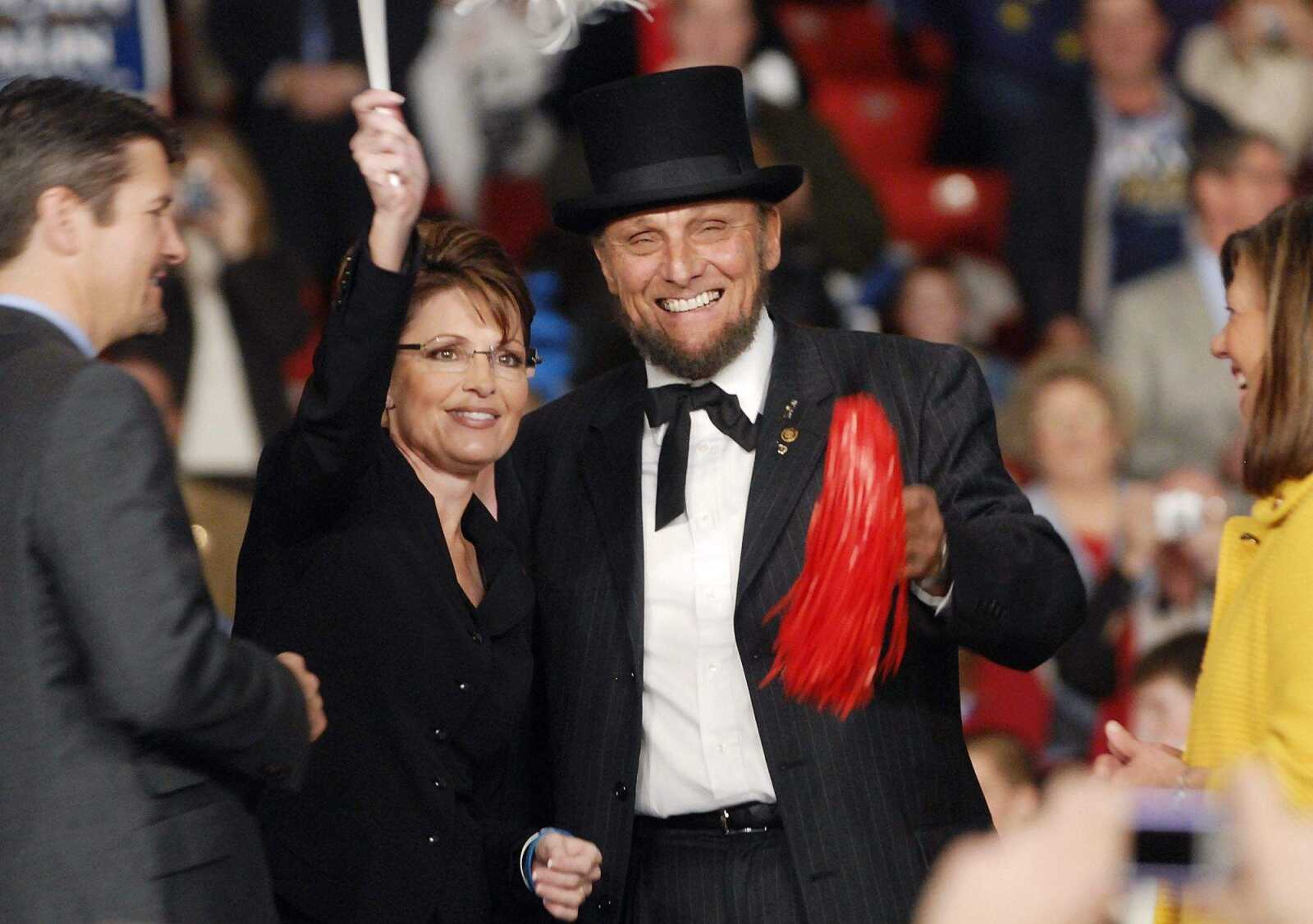 CHUCK WU ~ cwu@semissourian.com
Sarah Palin greets fans with George Engelbach on stage after the speech.