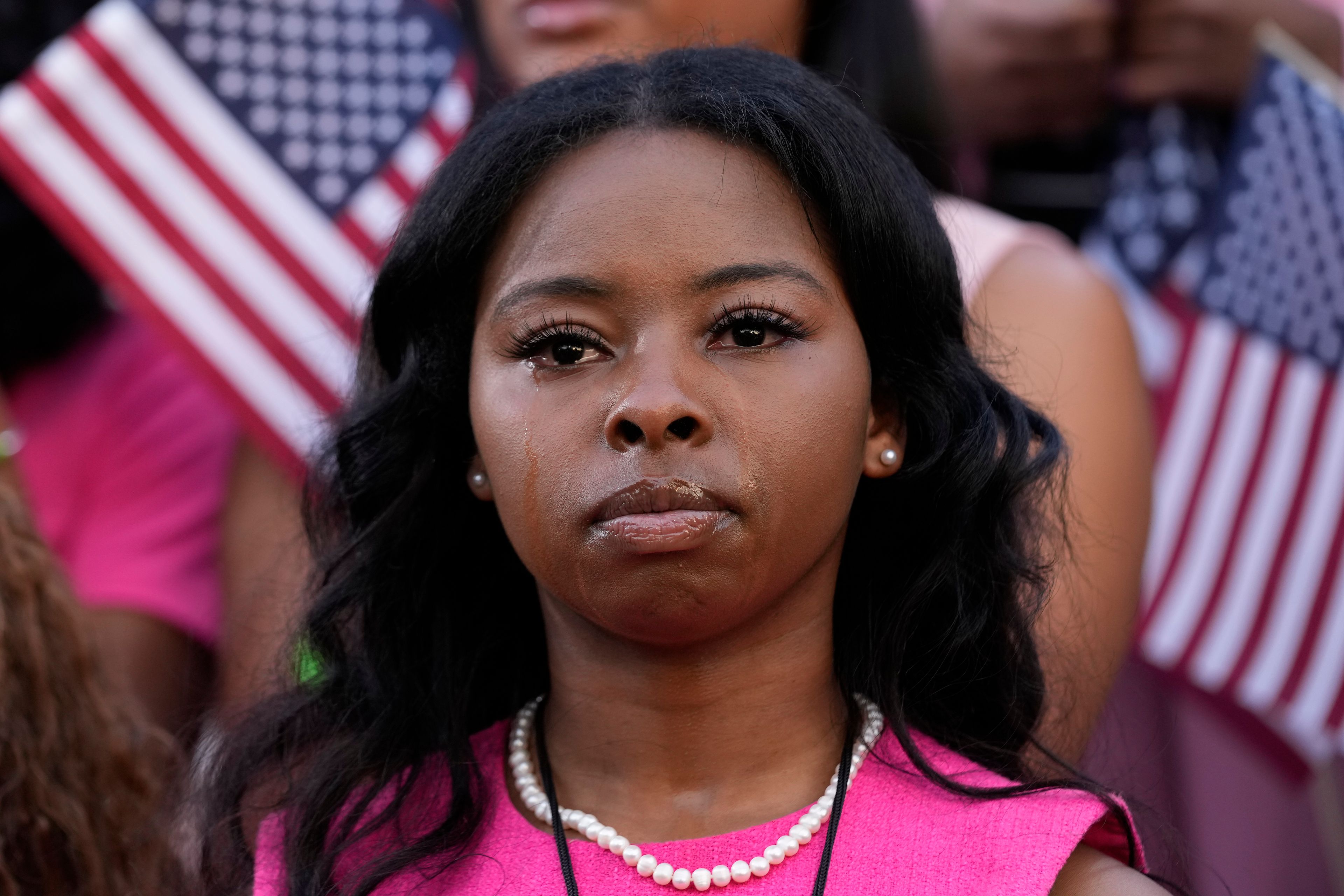 A supporter looks on as Vice President Kamala Harris delivers a concession speech for the 2024 presidential election, Wednesday, Nov. 6, 2024, on the campus of Howard University in Washington. (AP Photo/Susan Walsh)