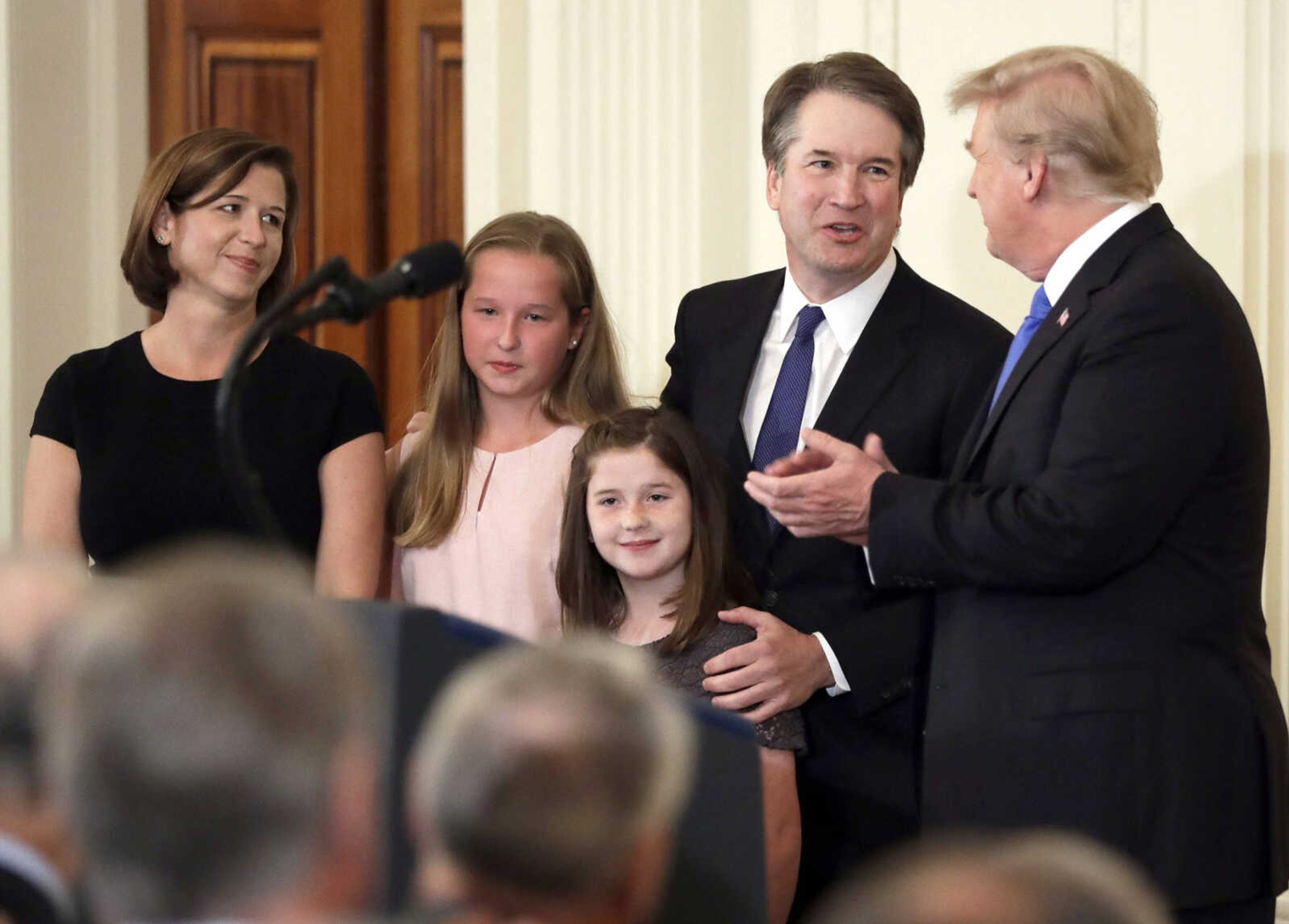 President Donald Trump greets Judge Brett Kavanaugh, his Supreme Court nominee, Monday in the White House.