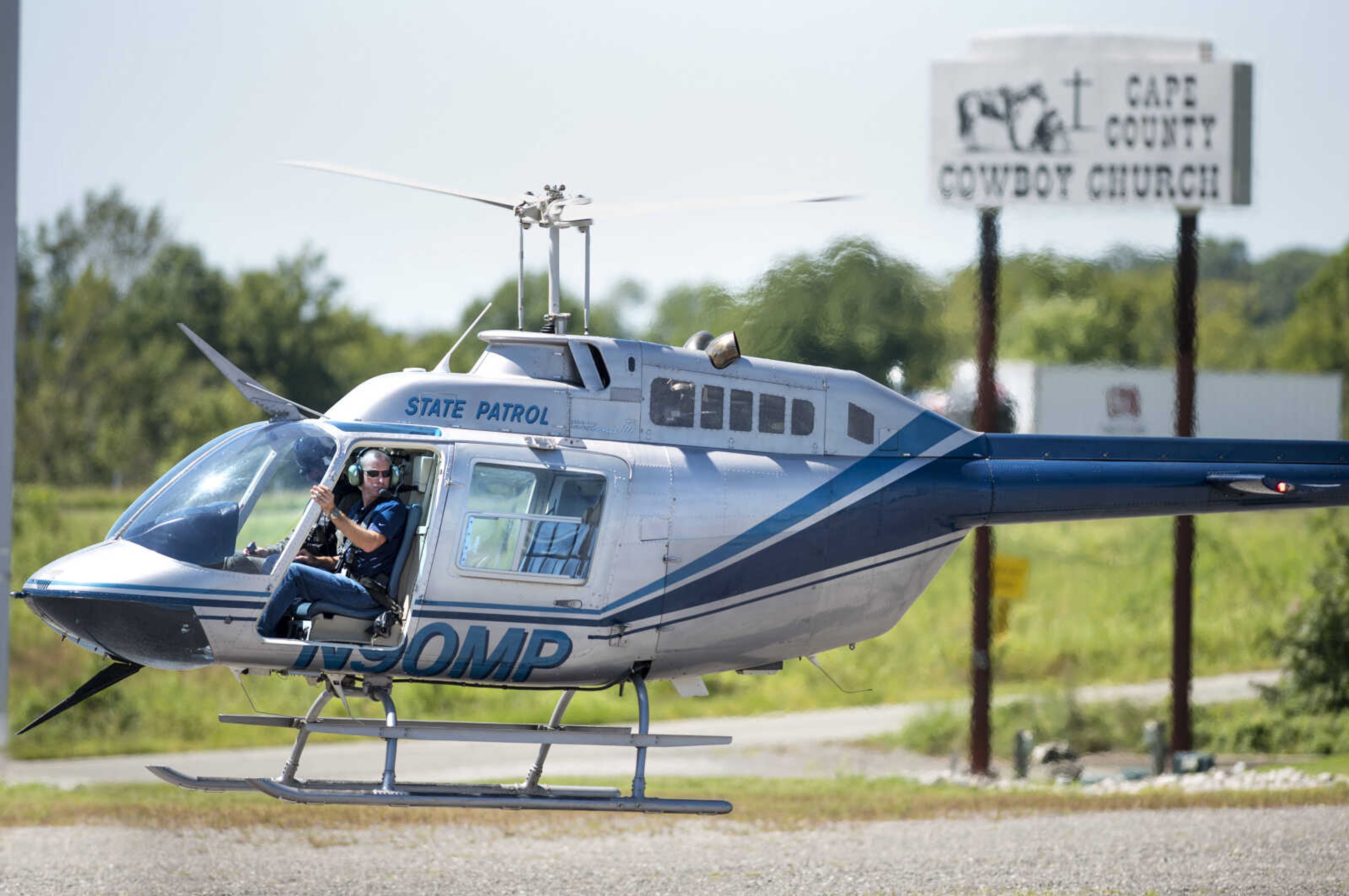 Emergency personnel search for a person who reportedly caused several traffic accidents while driving the wrong way down southbound Interstate 55 and then fled on foot into the woods near the Cape County Cowboy Church on Thursday, Aug. 29, 2019, east of Oak Ridge, Missouri.