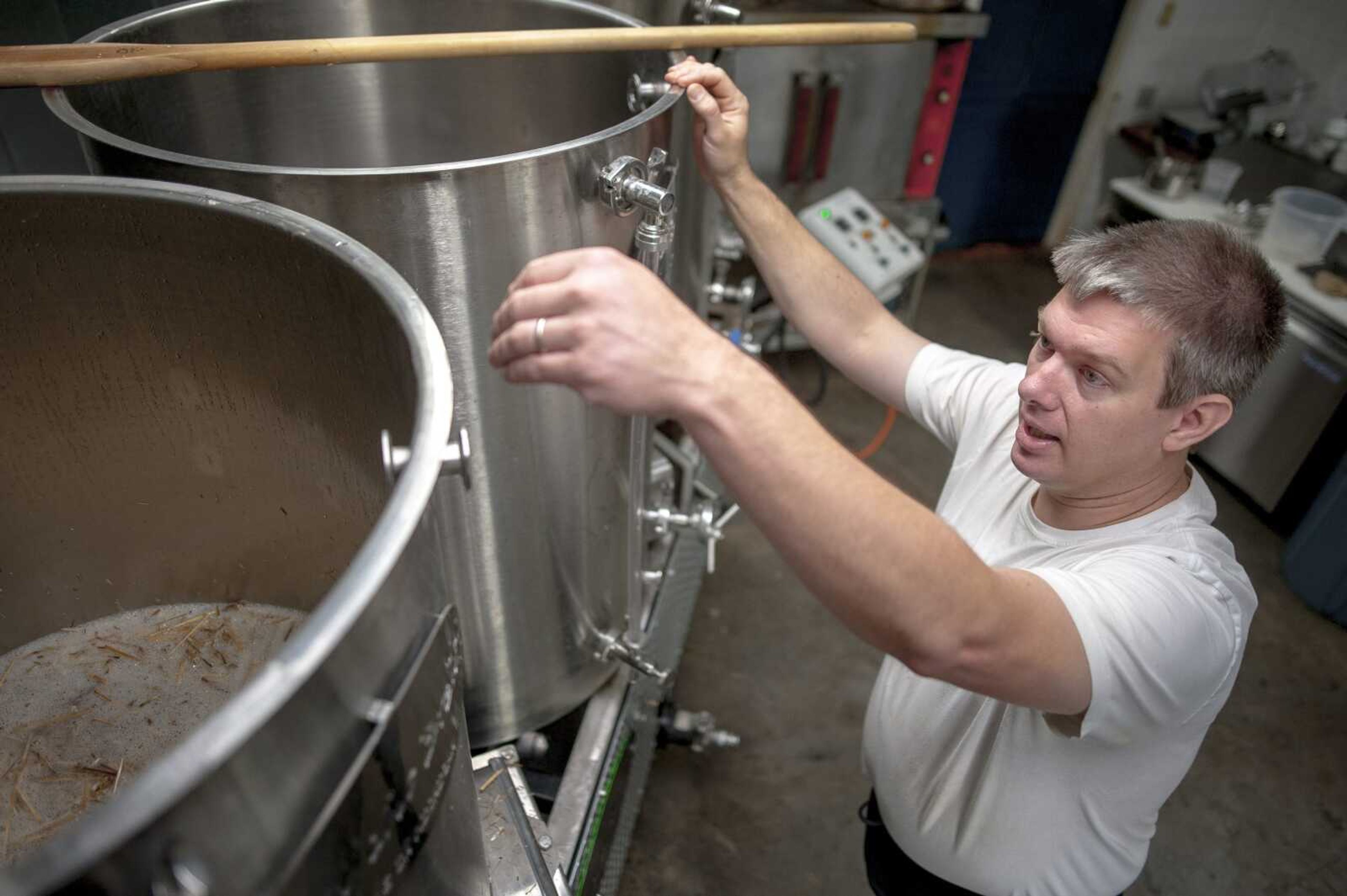 Brewer DeWayne Schaaf prepares to start the sparging process while making beer Tuesday at Ebb and Flow Fermentations in Cape Girardeau.