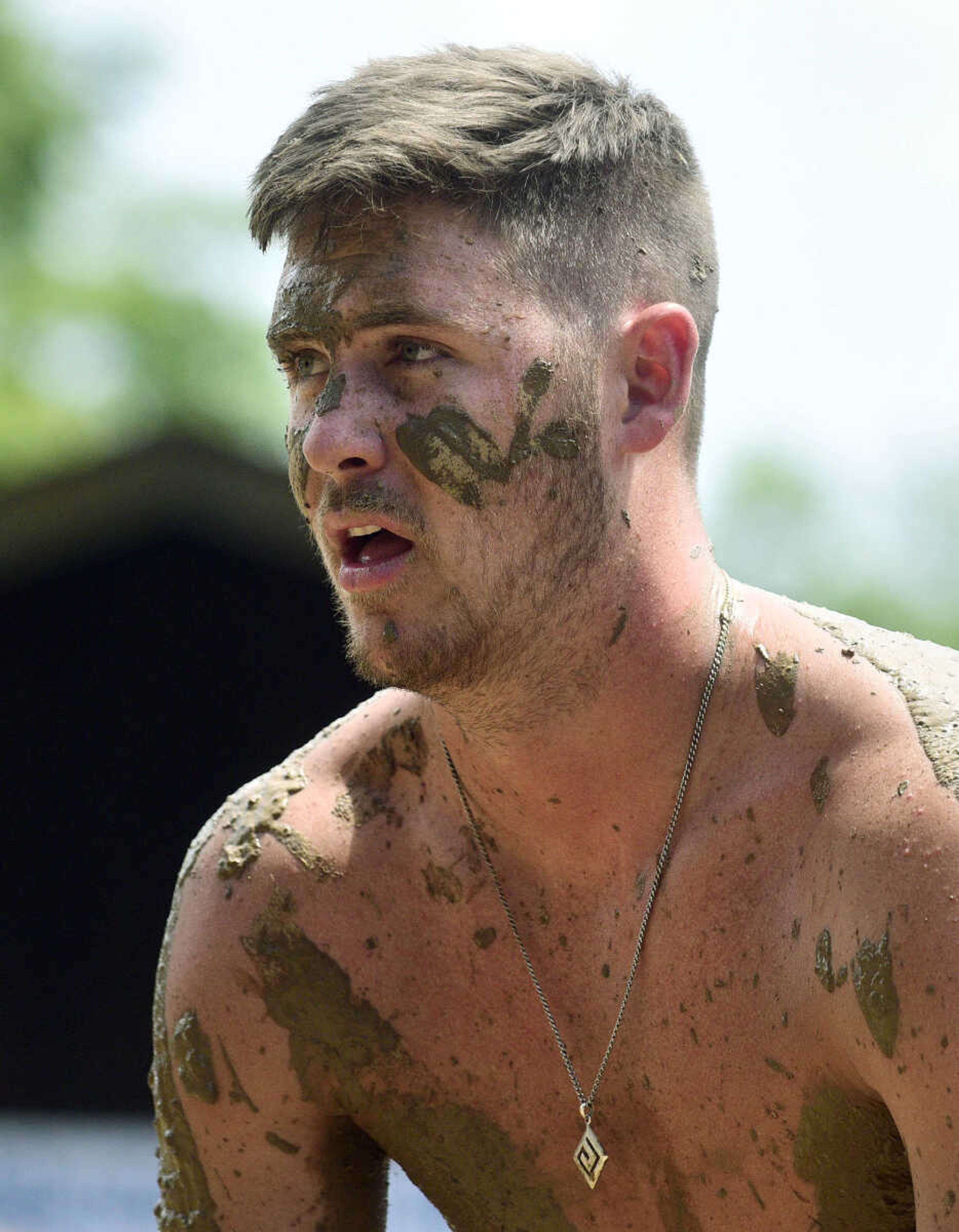 Quinn Poythress plays mud volleyball during the Fourth of July celebration on Tuesday at Jackson City Park.