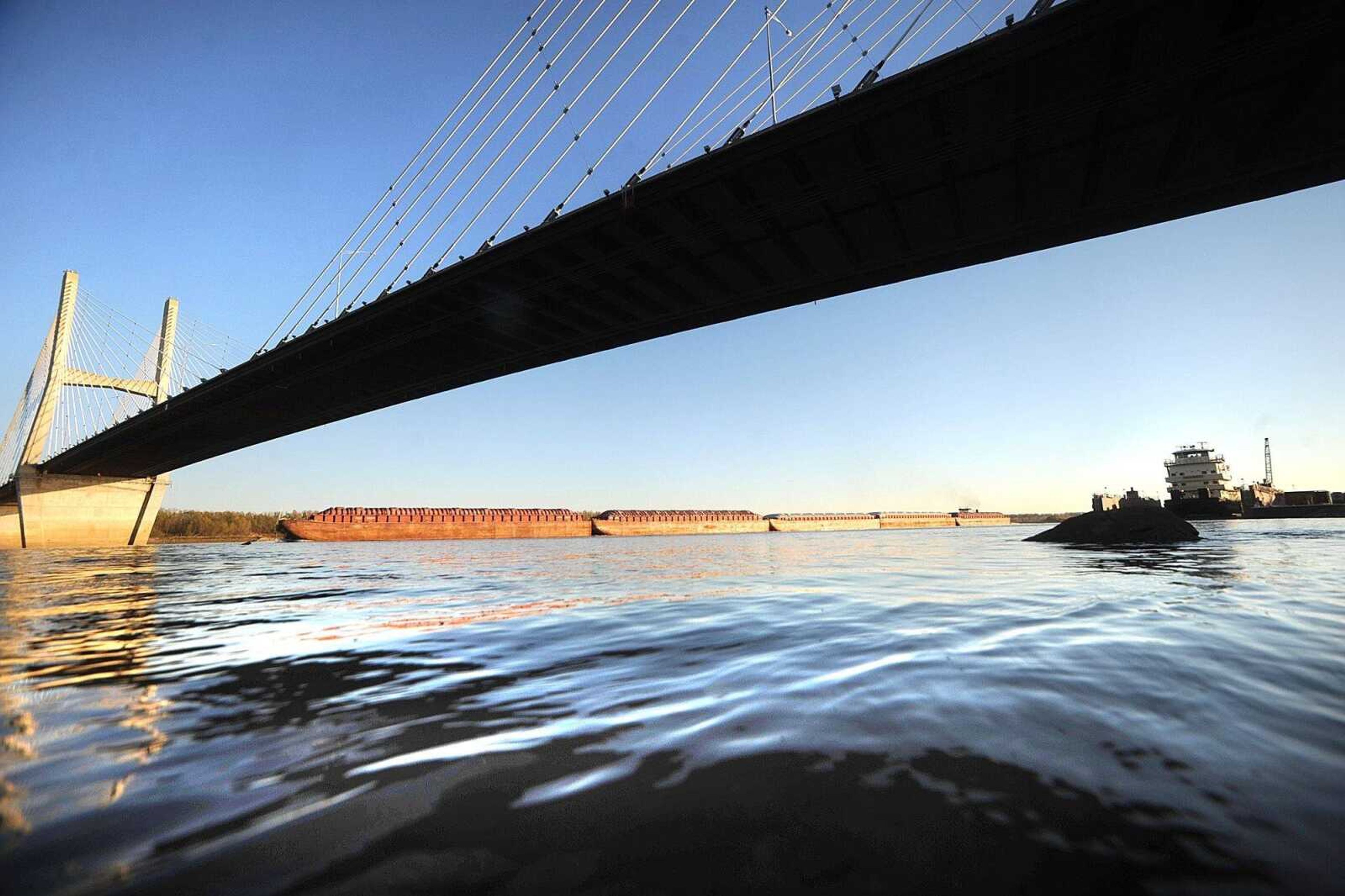 Marquette Transportation's Cindy L. Erickson travels under the Bill Emerson Memorial Bridge as it transports barges north on the Mississippi River Monday, Nov. 12, 2012 in Cape Girardeau. (Laura Simon)