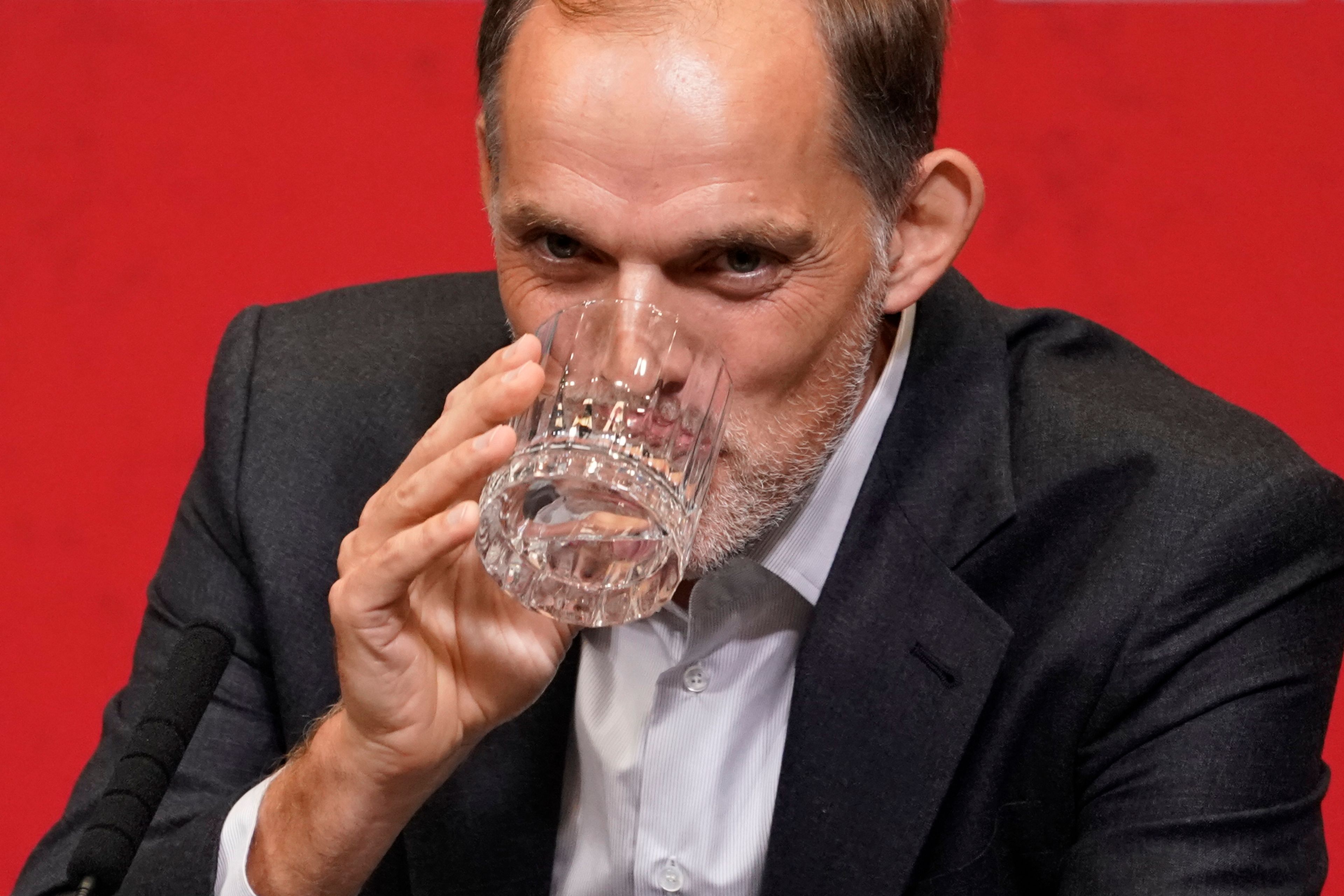 The newly appointed England men's soccer team manager Thomas Tuchel takes a drink as he listens to a question during a press conference held at Wembley Stadium in London, Wednesday, Oct. 16, 2024. (AP Photo/Alberto Pezzali)