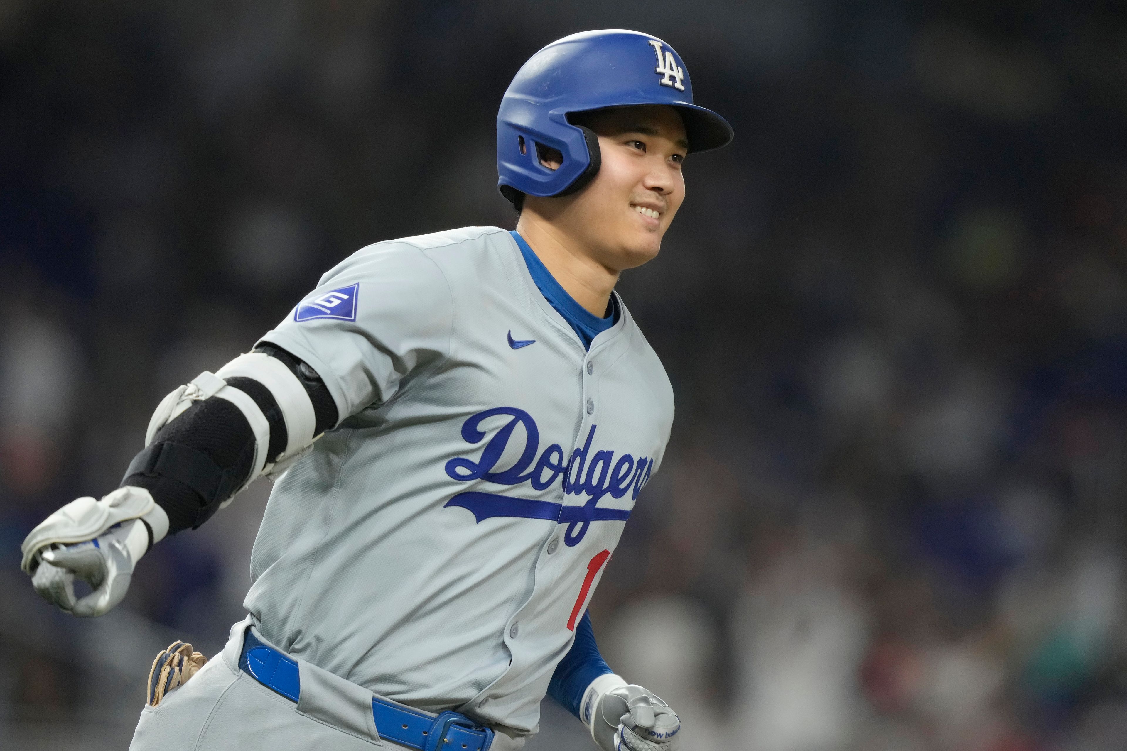 Los Angeles Dodgers' Shohei Ohtani (17) gestures after hitting a home run during the sixth inning of a baseball game against the Miami Marlins, Thursday, Sept. 19, 2024, in Miami. (AP Photo/Marta Lavandier)